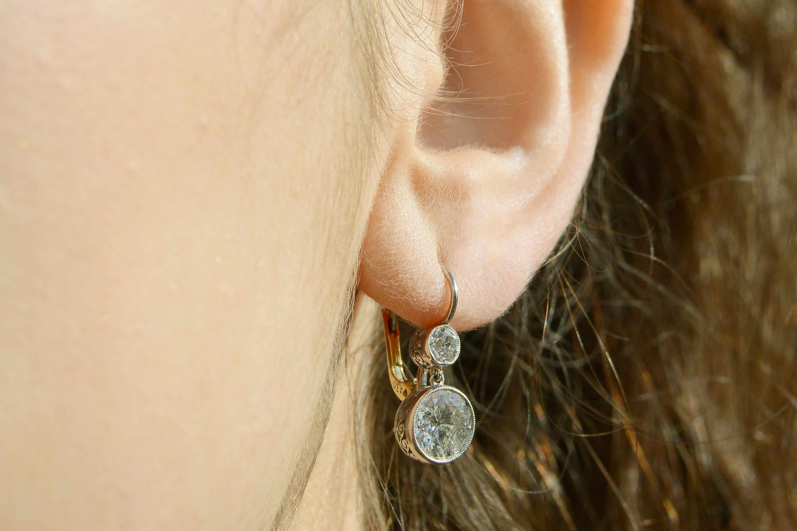 Platinum and 18k yellow gold leverback earrings with 4.30 carats of diamonds.