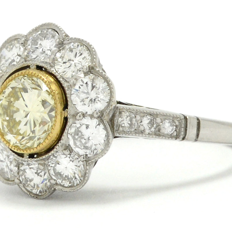 A bezel set round brilliant diamond platinum, Art Deco style engagement ring.