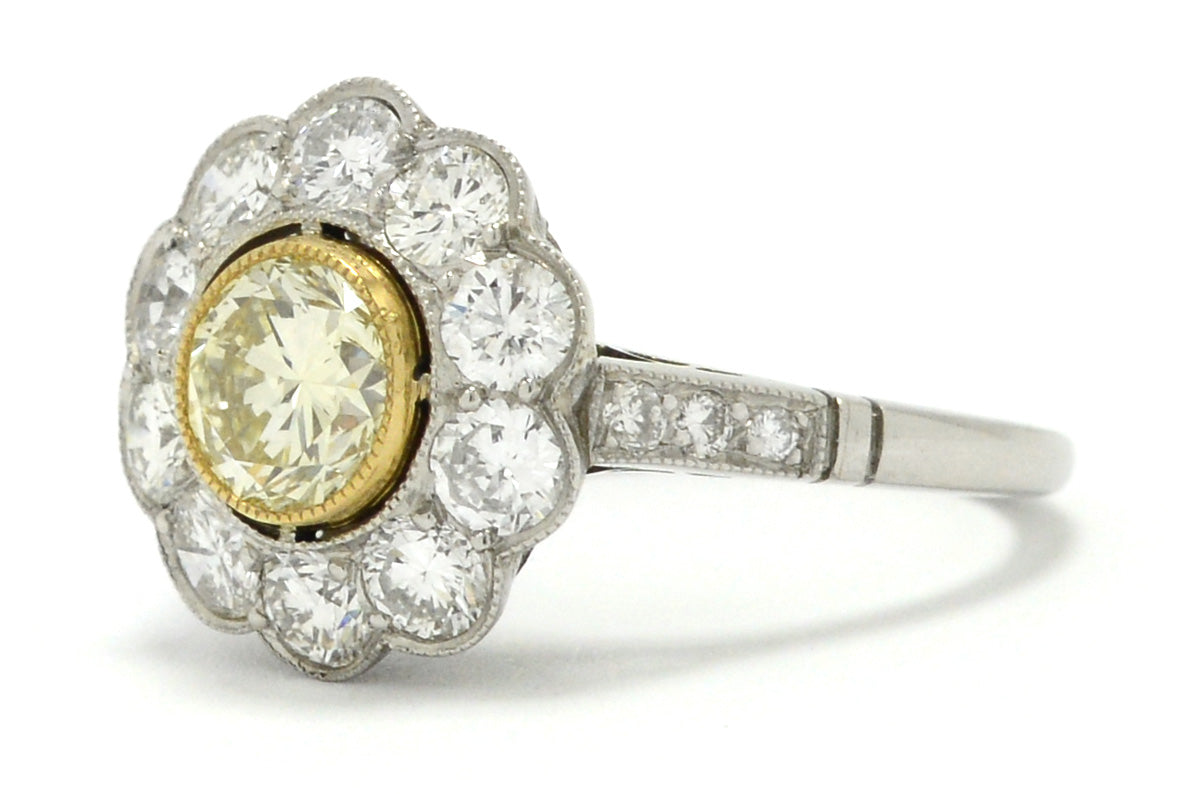 A bezel set round brilliant diamond platinum, Art Deco style engagement ring.