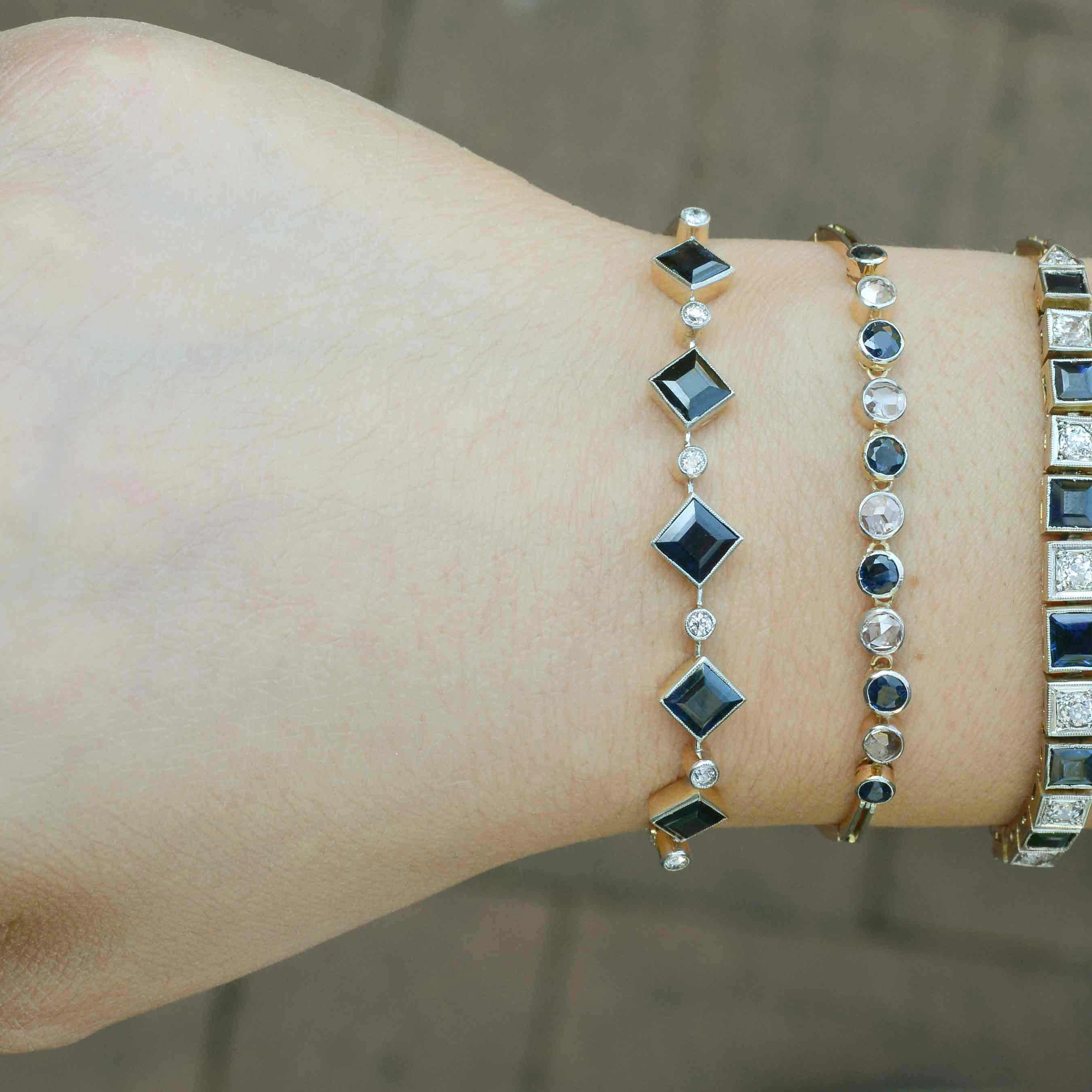 A collection of antique diamond and sapphire line bracelets available from our shop.