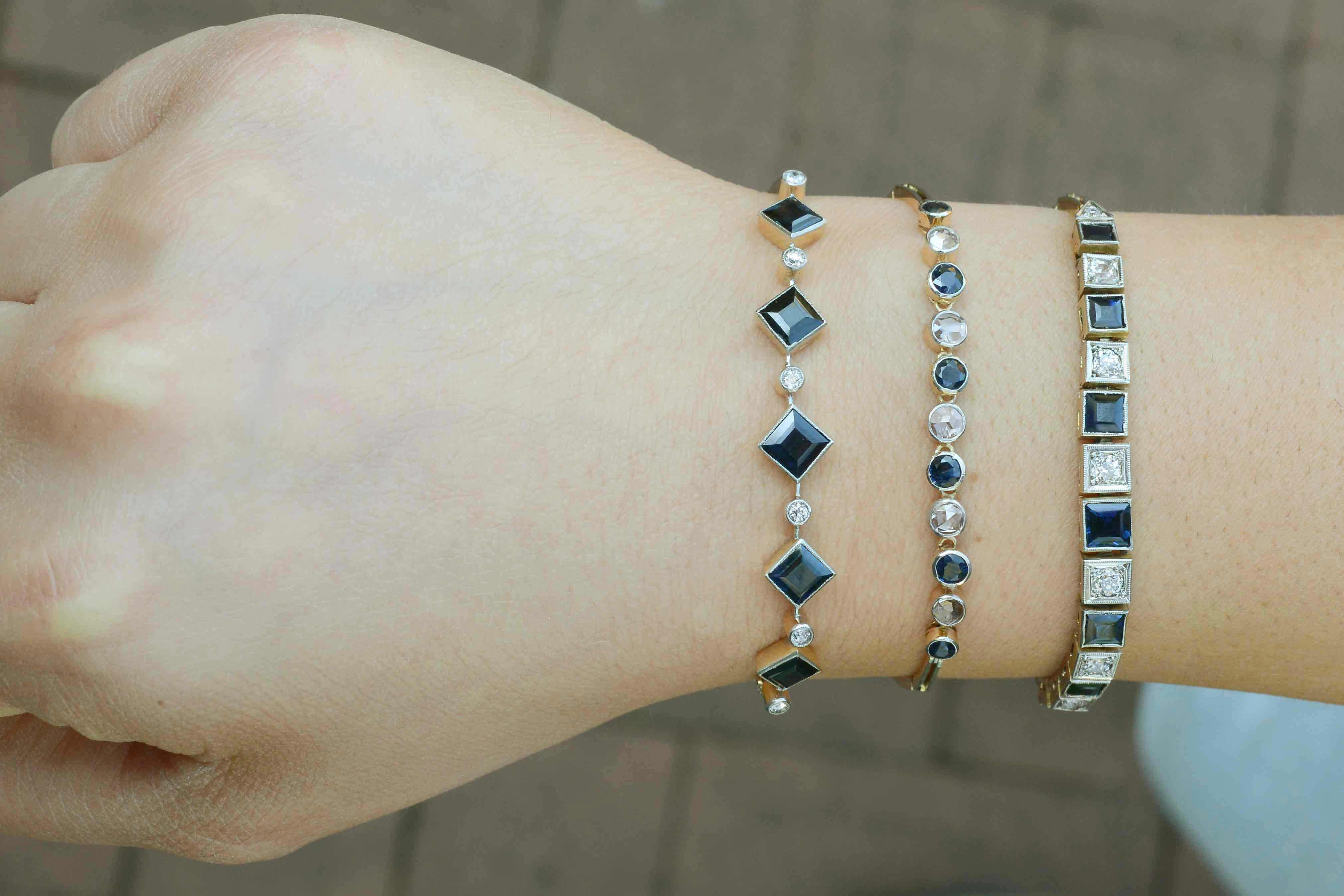 A collection of antique diamond and sapphire line bracelets available from our shop.