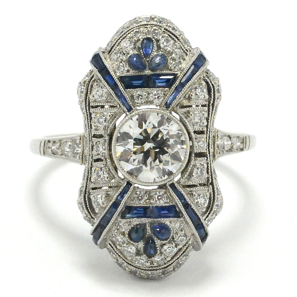 A geometric diamonds and sapphires platinum engagement ring.