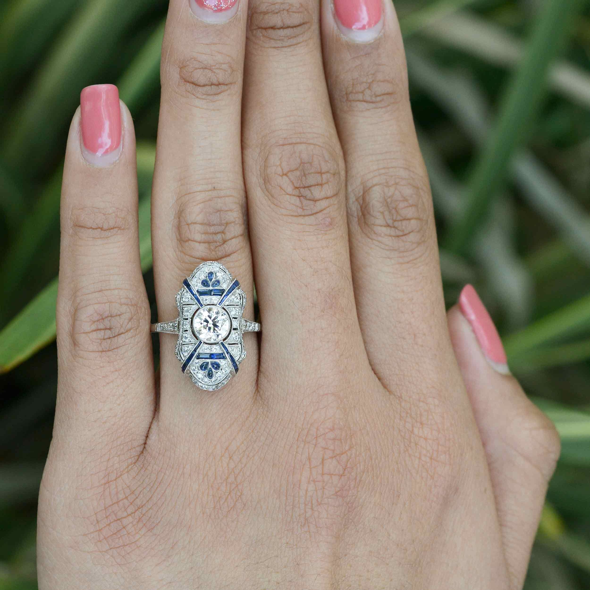 A shield design, platinum antique Art Deco engagement ring.