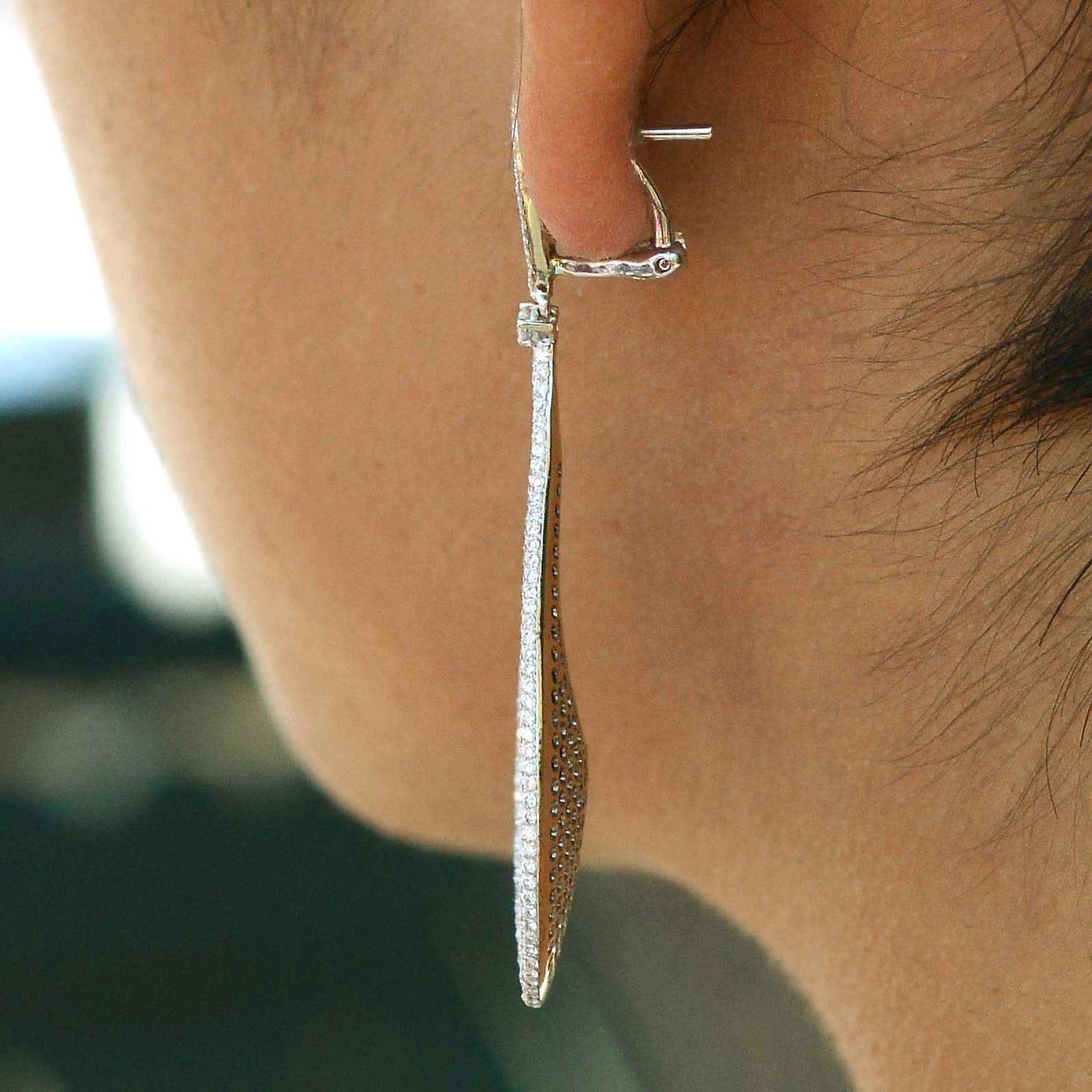 2 inch long lever back diamond hoop earrings.
