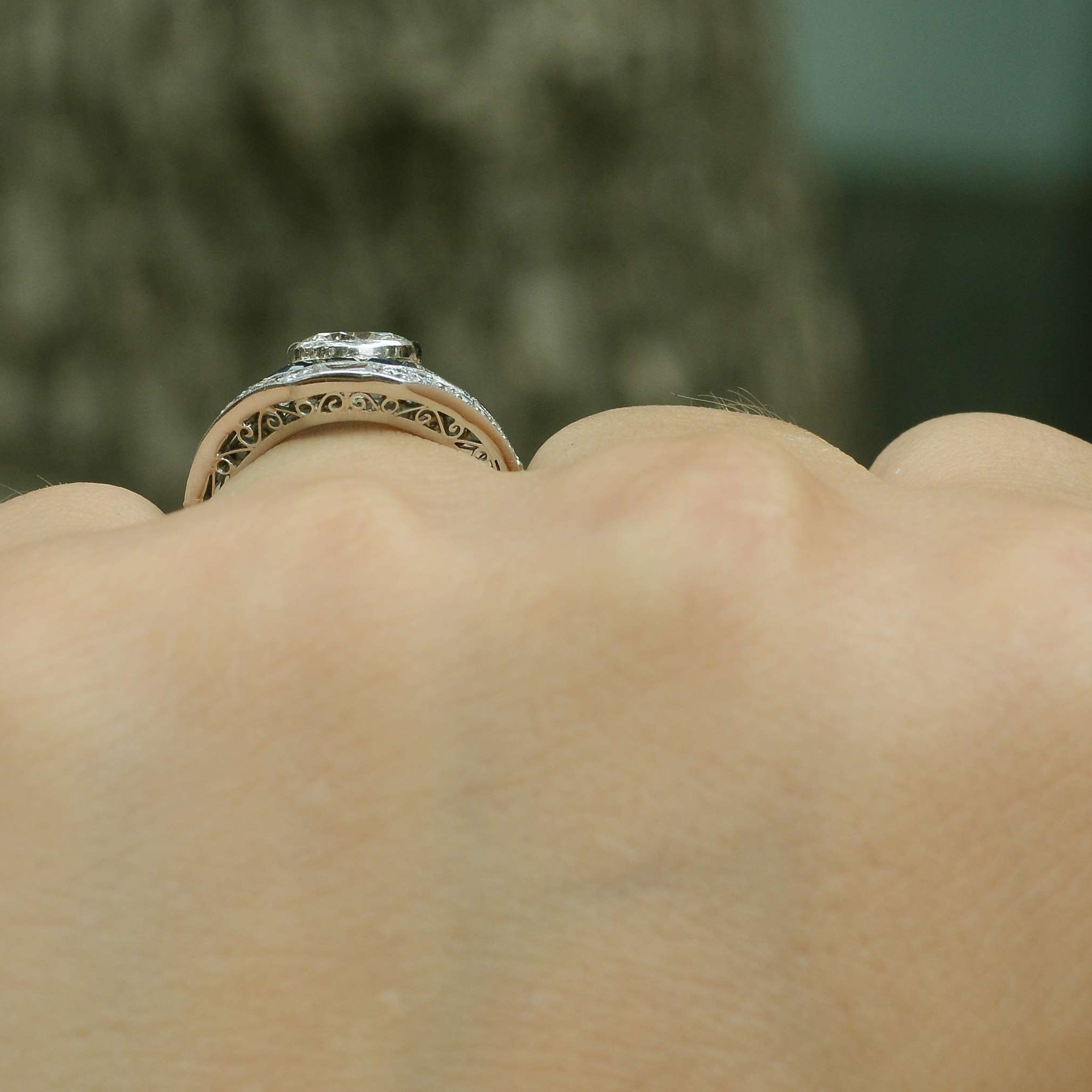 The 1 carat round cut diamond is in a bezel setting that won't snag on your clothes.