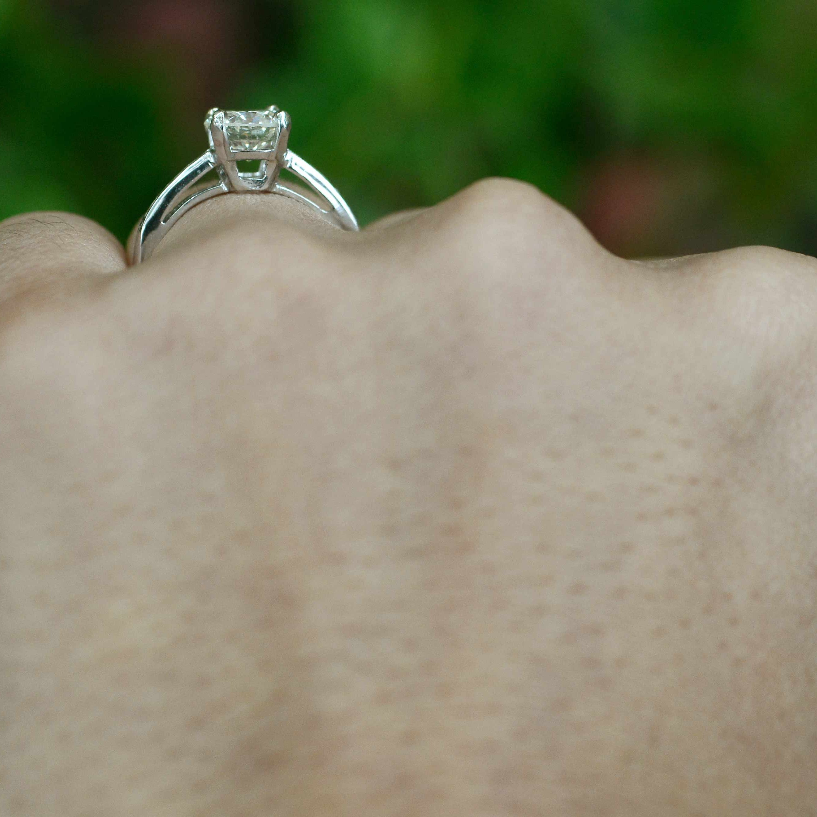 A secure four prong diamond setting solitaire ring.