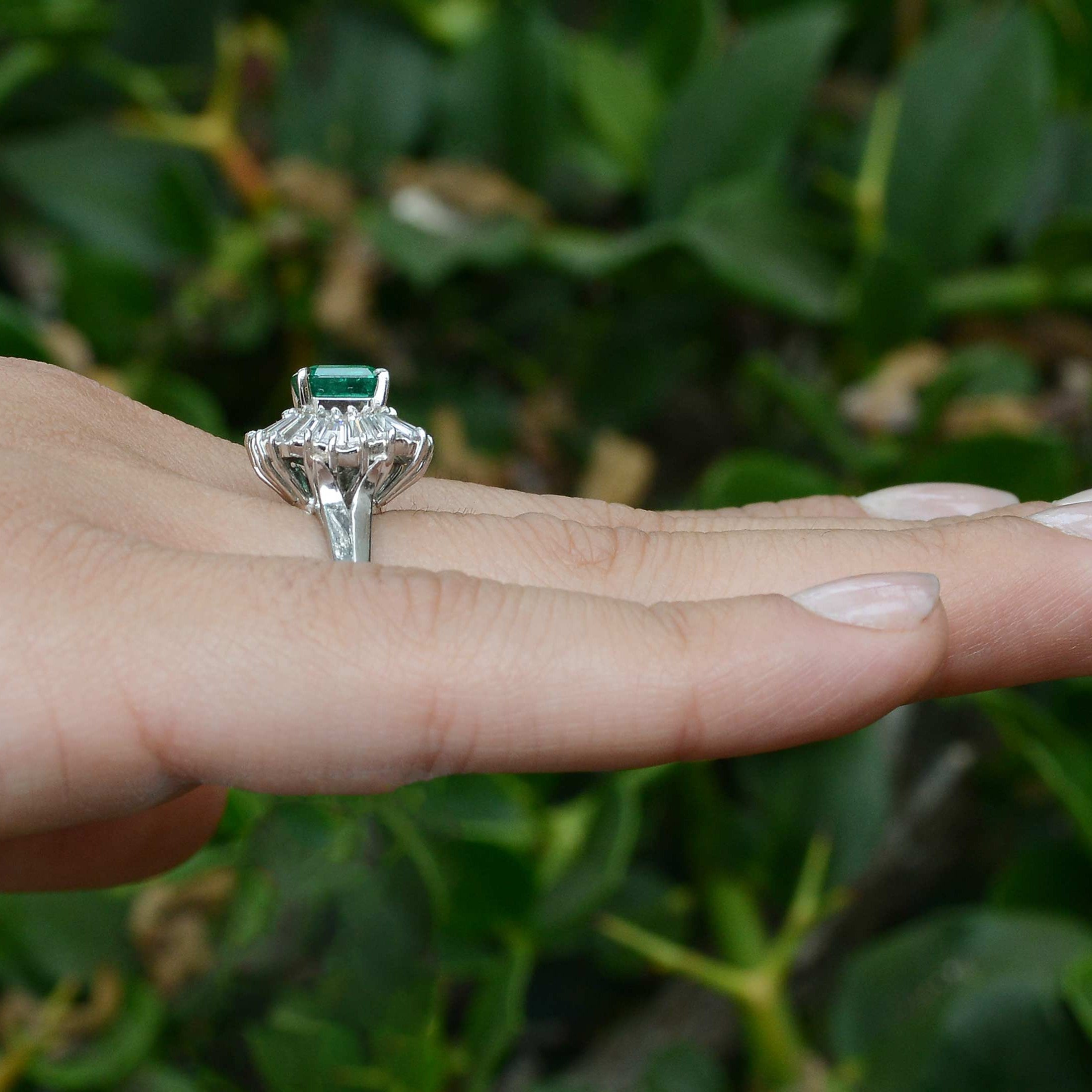 A tall, platinum emerald & diamond mid-century statement ring design.