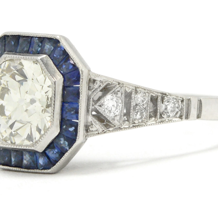 An octagon diamond and blue sapphires target engagement ring.