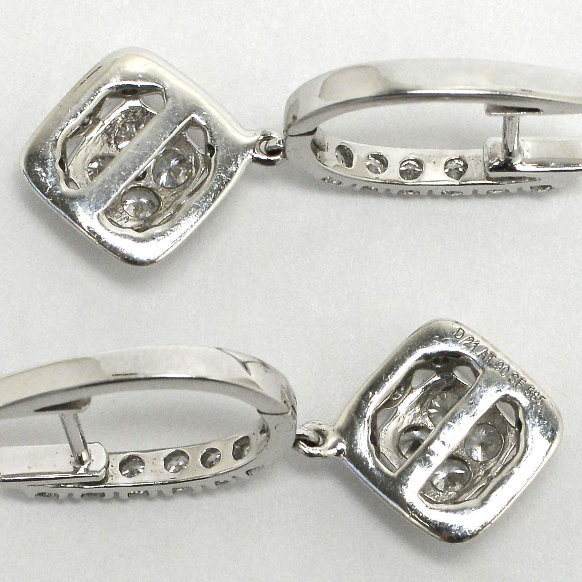 G - h color diamonds with vs2 - si1 clarity white gold earrings.