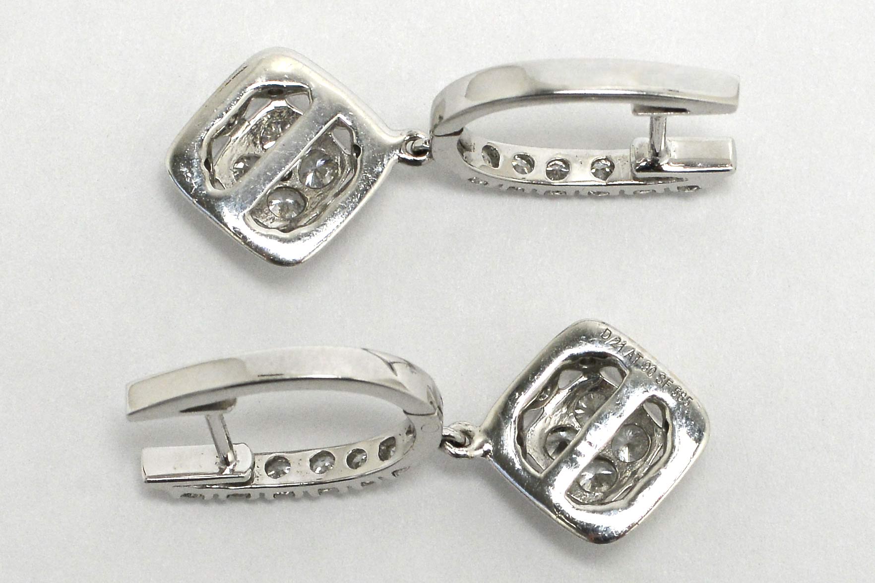 G - h color diamonds with vs2 - si1 clarity white gold earrings.