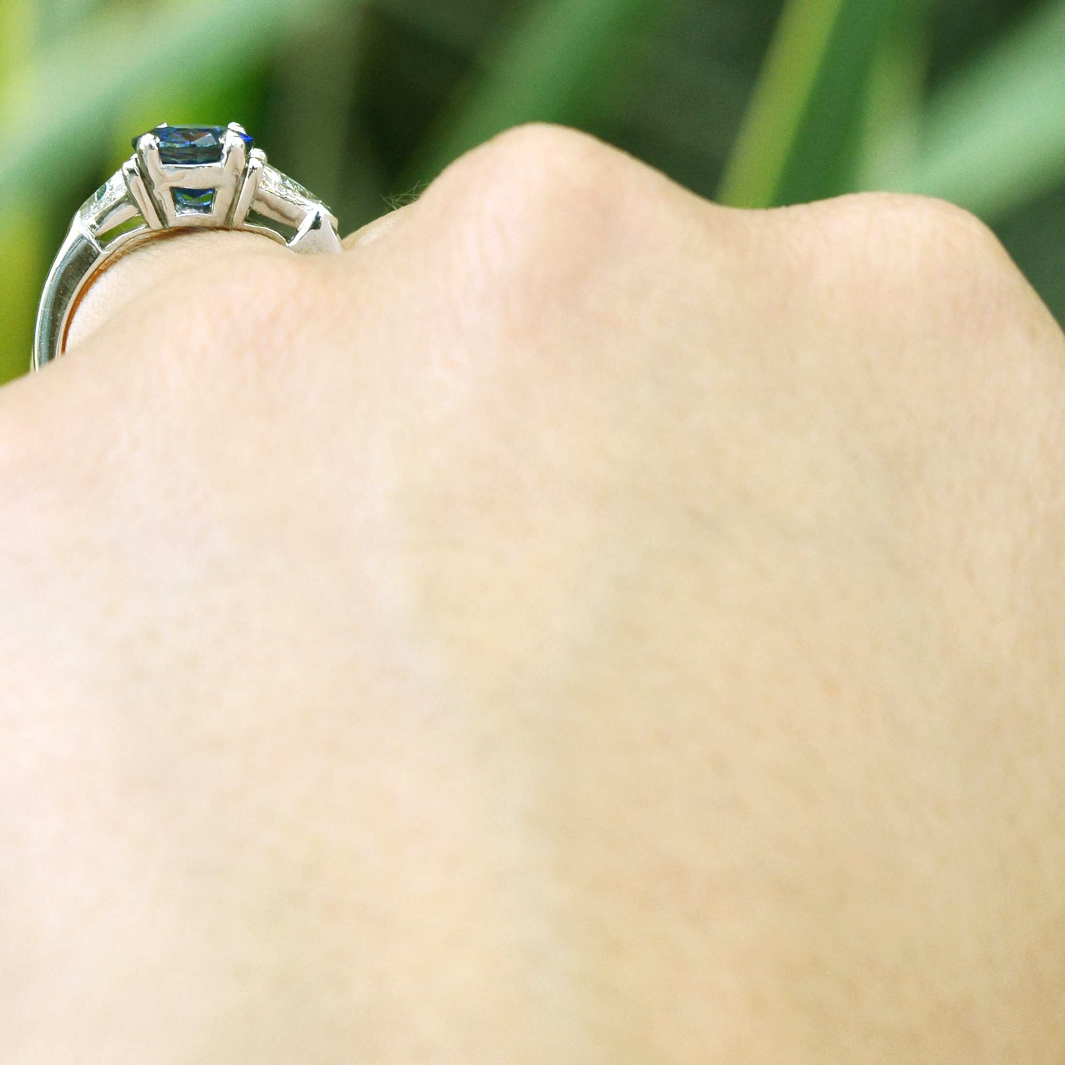 A vivid, intense royal blue sapphire set in a platinum setting.