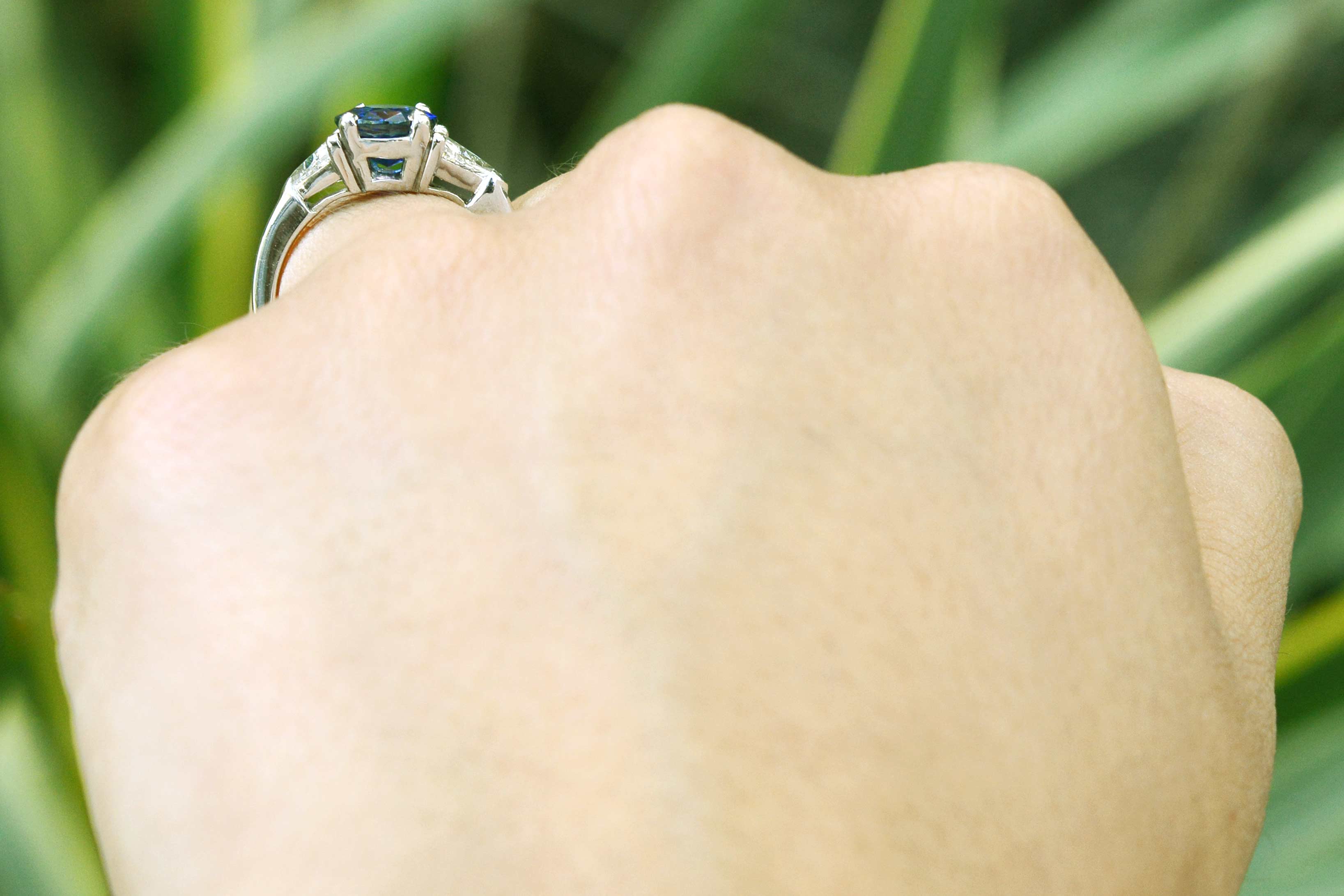 A vivid, intense royal blue sapphire set in a platinum setting.