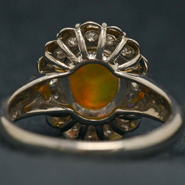 An Australian crystal jelly opal set in a platinum ring with diamonds.