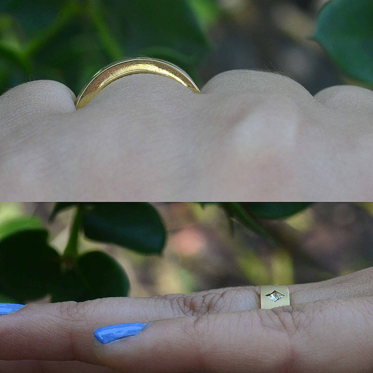 A modernist gold anniverary band with different cuts of diamonds.