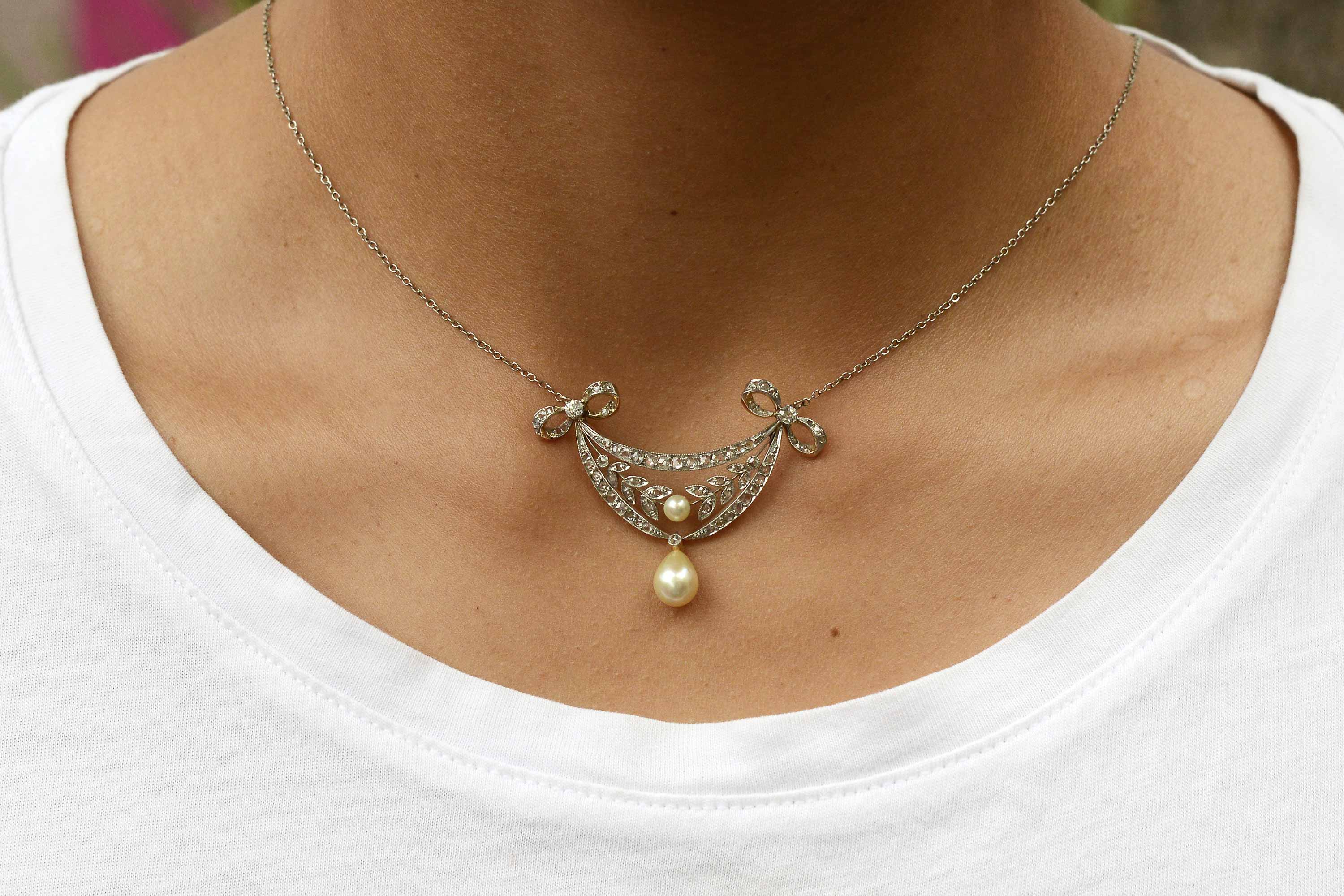 A delicate antique diamonds wreath necklace with 2 natural pearls.