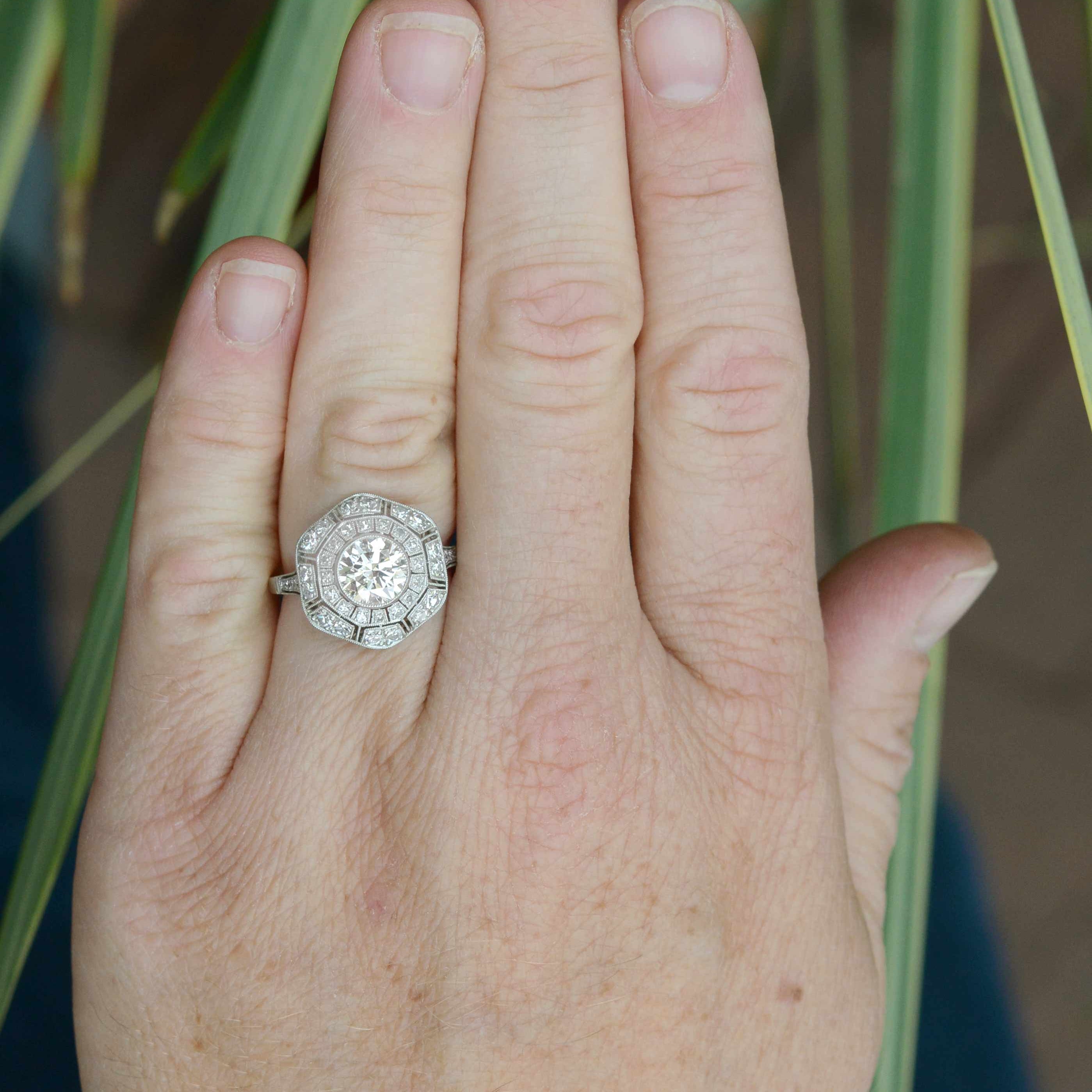 Diamonds platinum flower cluster ring.