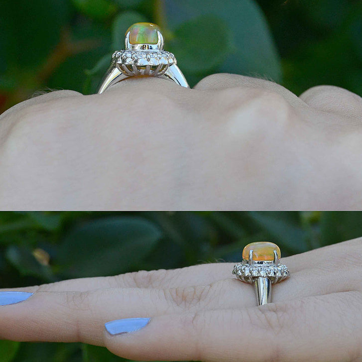 An oval cabochon opal dome ring with diamonds.