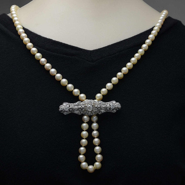 Here is an example on how to string a pearl strand through this diamond brooch.