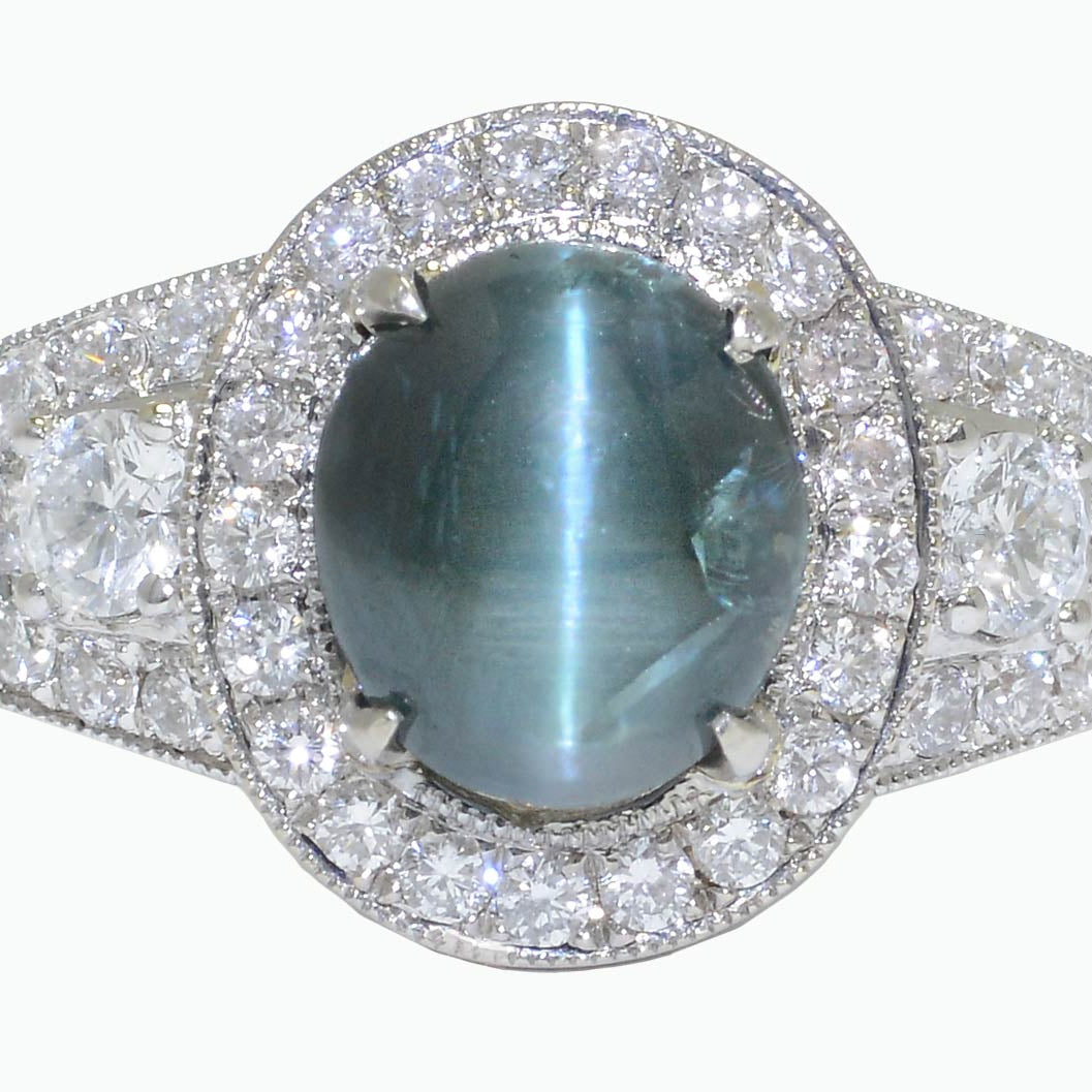This engagement ring features a rare, color changing alexandrite gemstone.