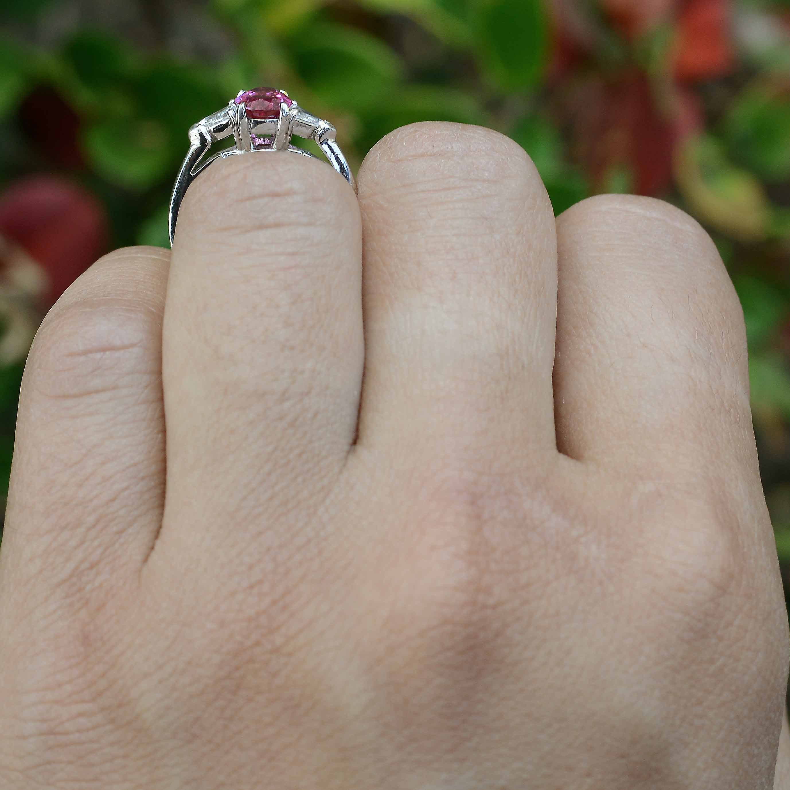 A 3 stone platinum trinity engagement ring design with natural gems.