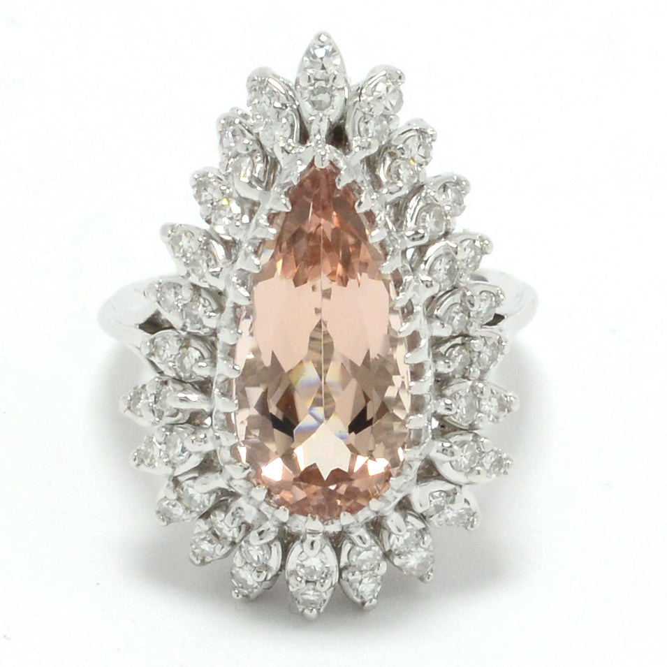 A natural, peach-colored morganite gemstone and diamonds statement ring.