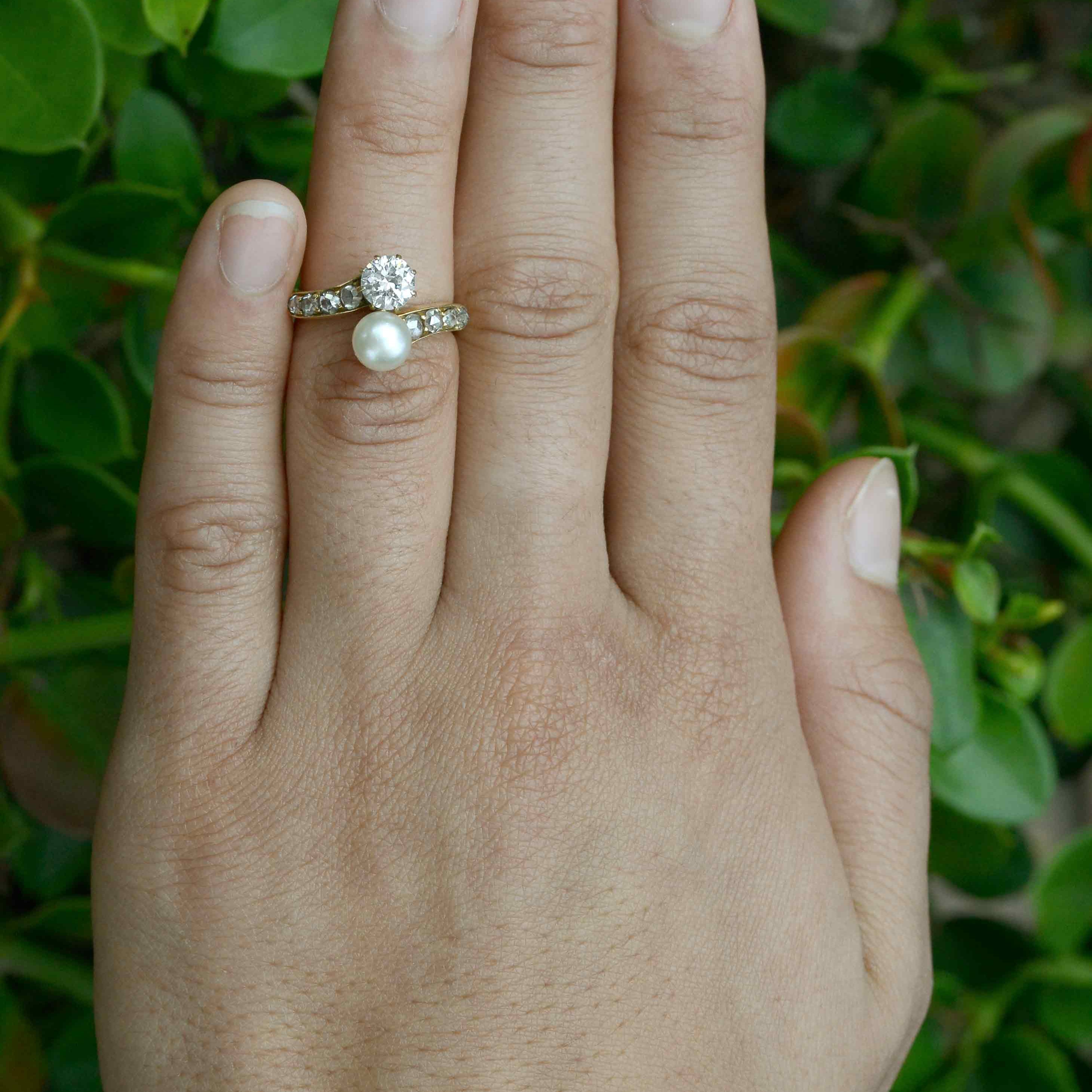 A diamond and pearl toi et moi 2 stone antique wedding ring.
