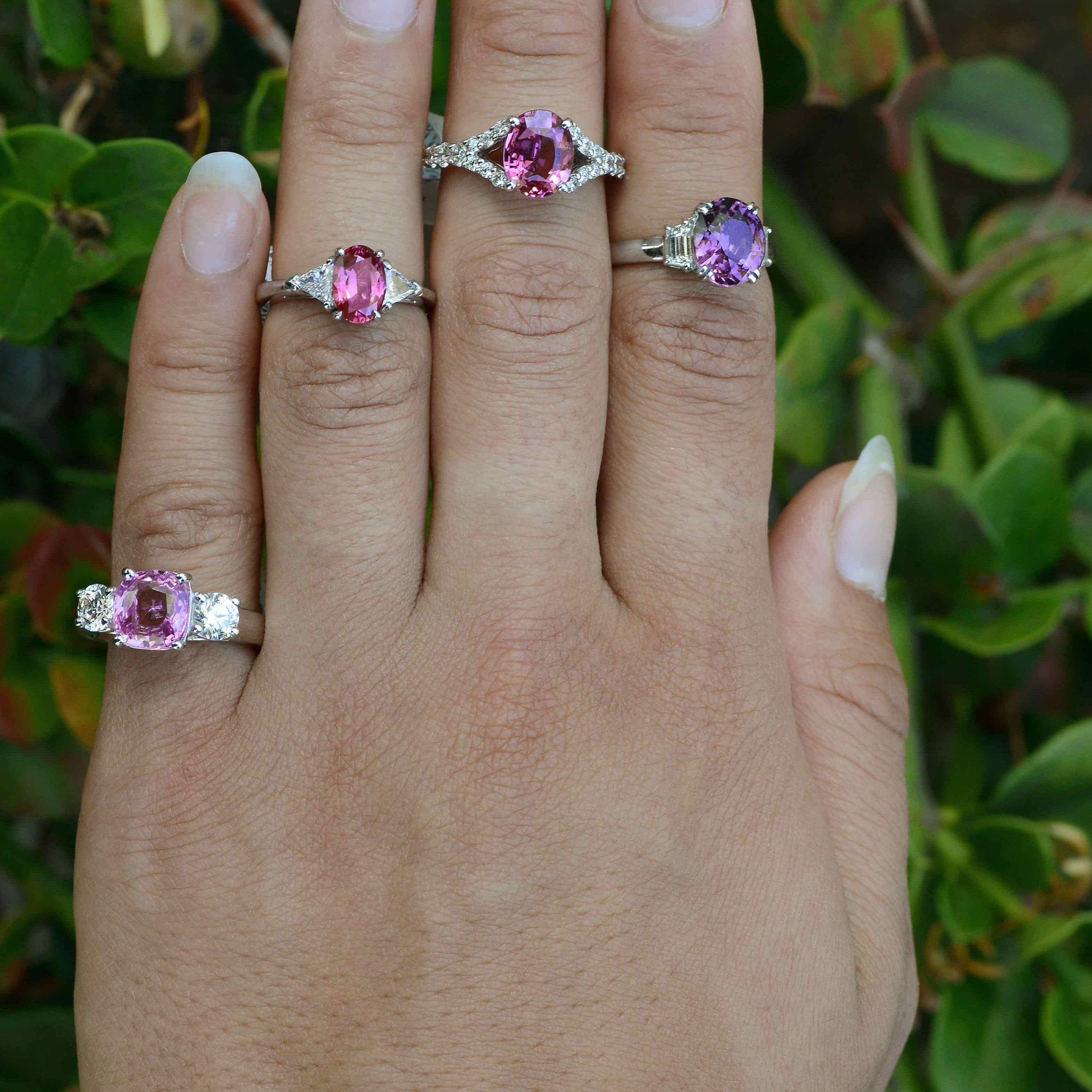 Natural pink and purple sapphire engagement rings with diamonds available.