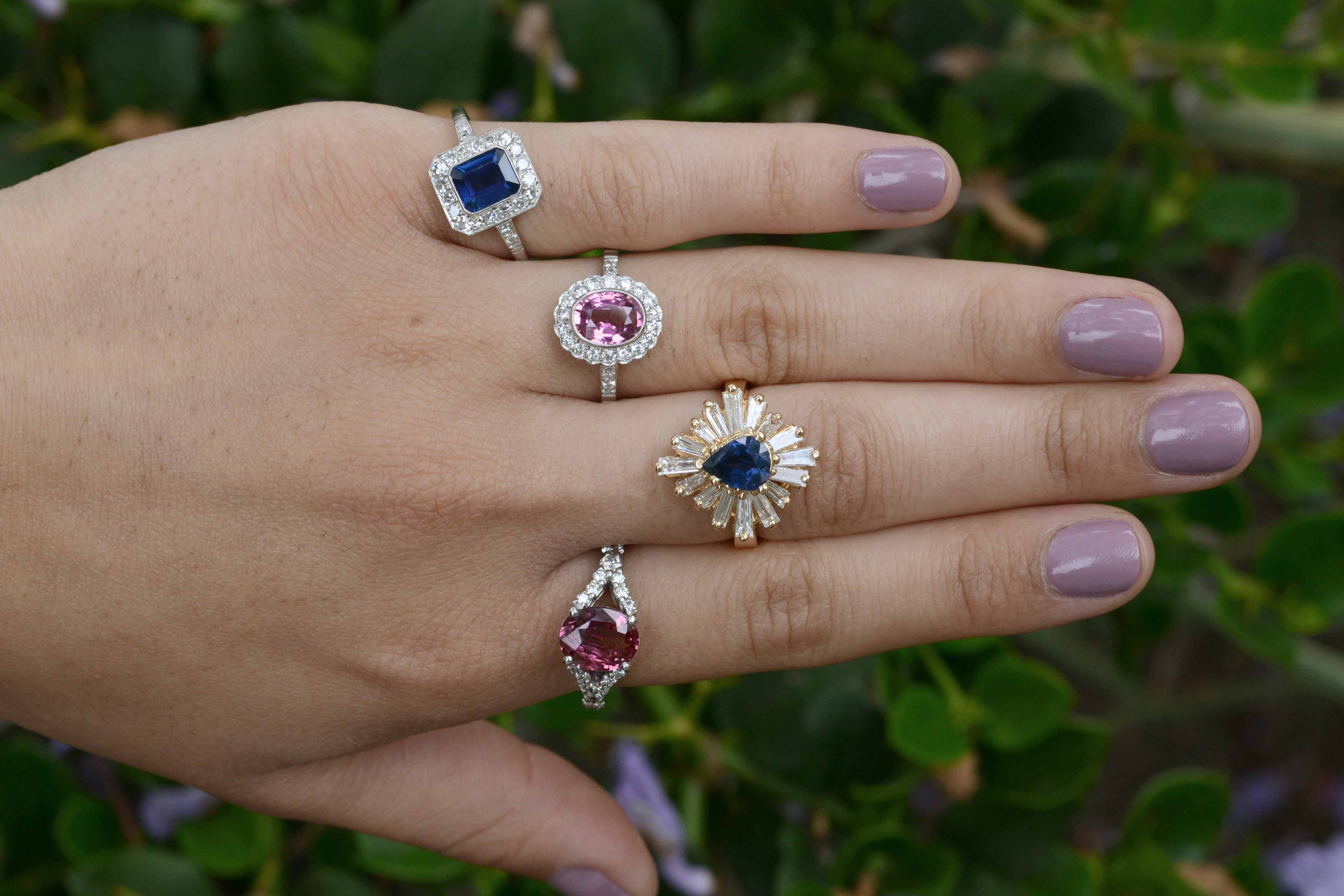 Sapphire and diamond halo Art Deco engagement rings.