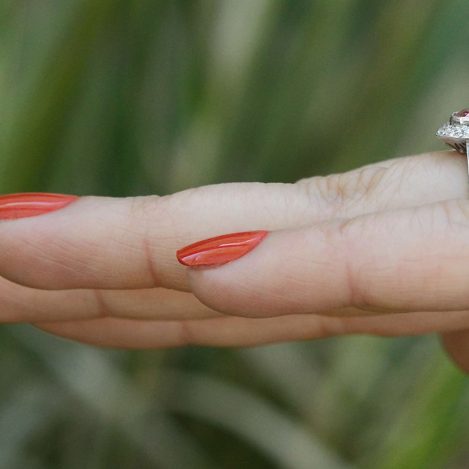 This sapphire displays vivid medium pink color, with great transparency.