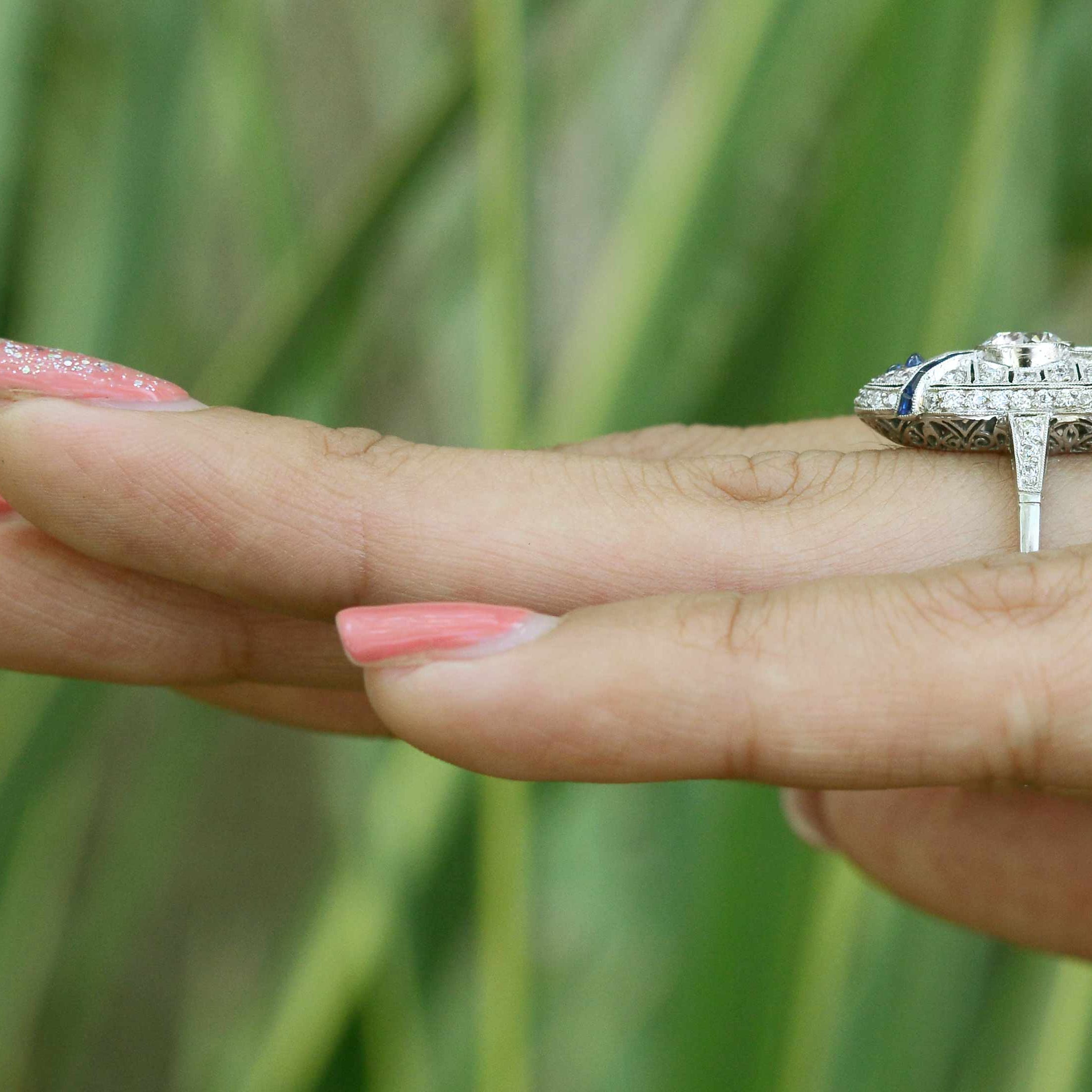 A long platinum cocktail ring with a transitional round brilliant diamond.