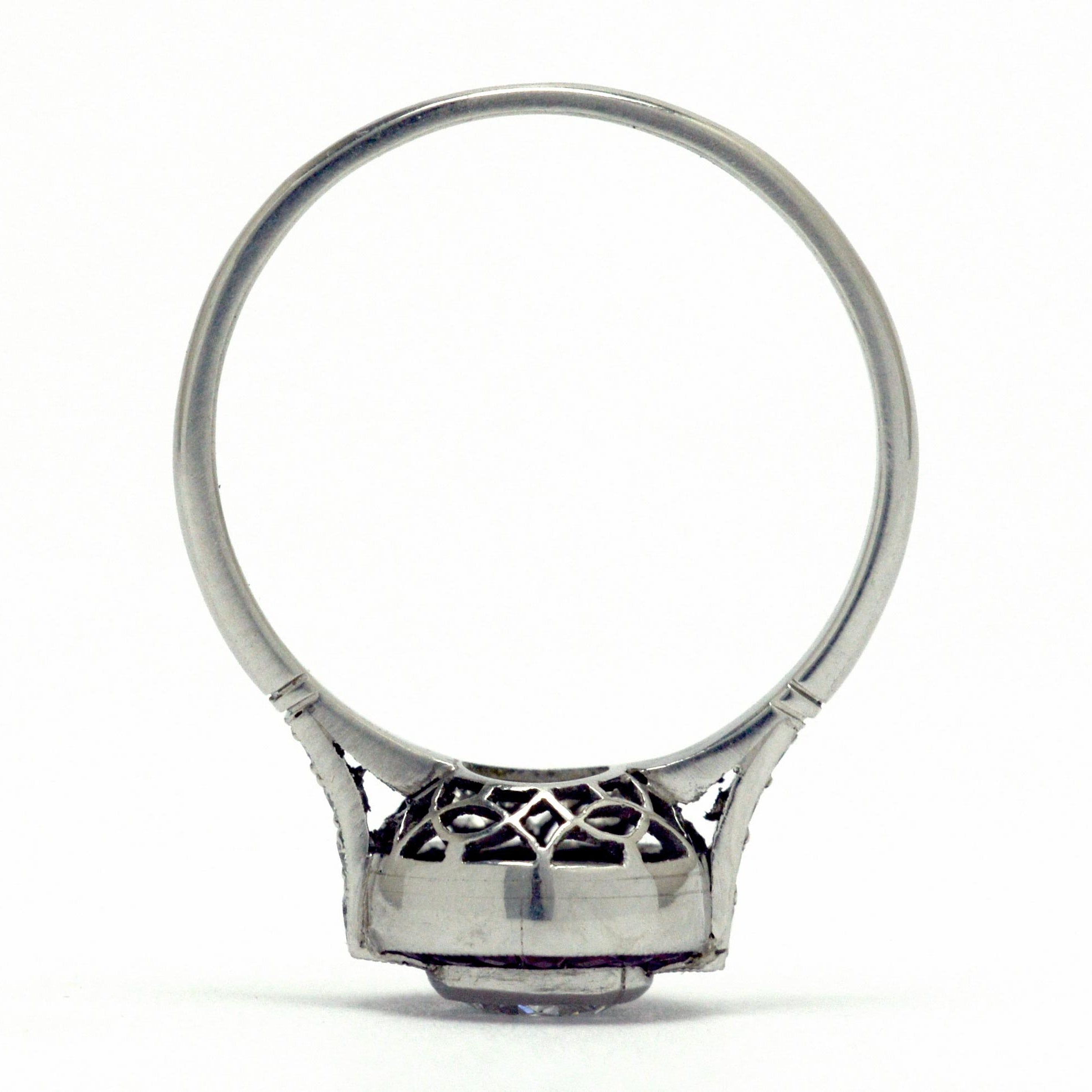 A platinum bezel diamond engagement ring design.