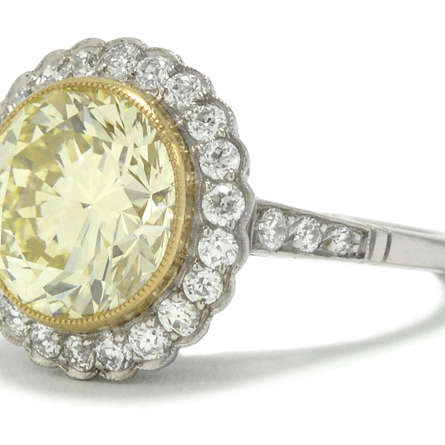This platinum engagement ring is lined with an 18k gold bezel to support the 5 carat diamond.