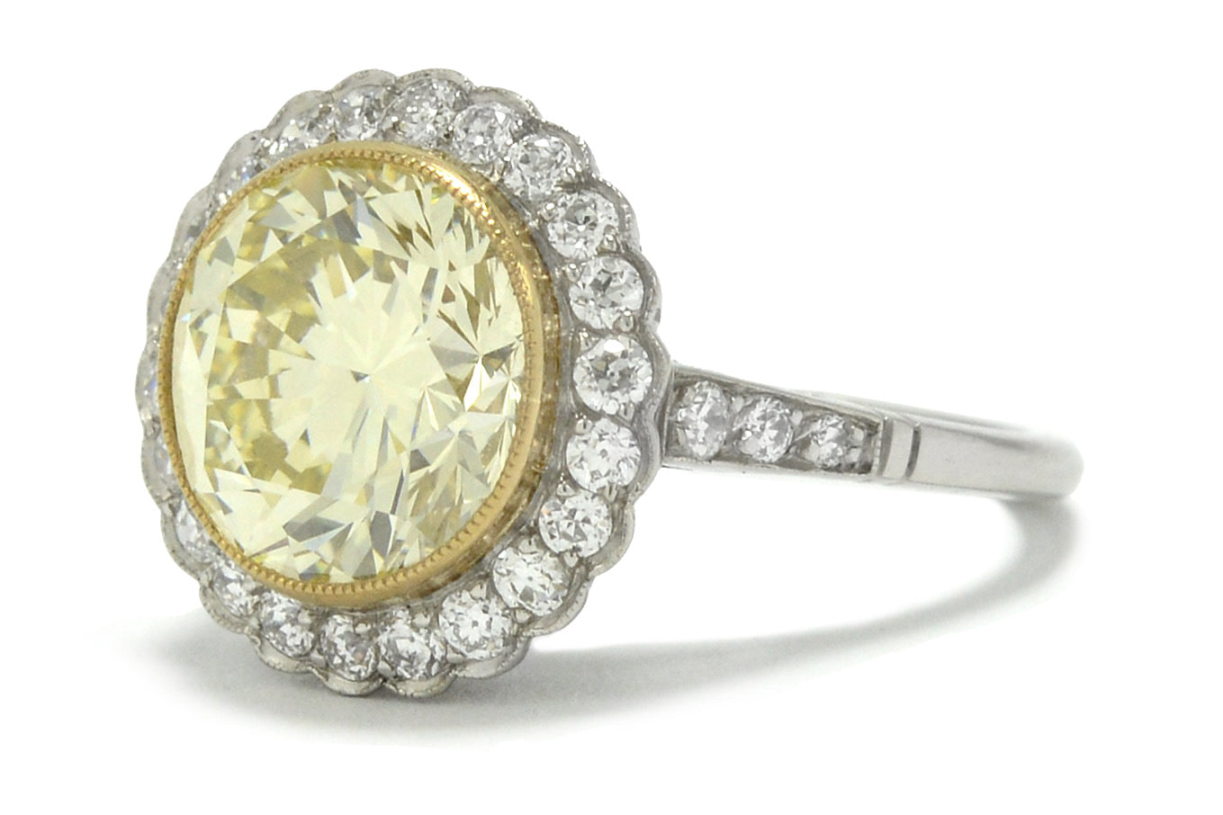 This platinum engagement ring is lined with an 18k gold bezel to support the 5 carat diamond.