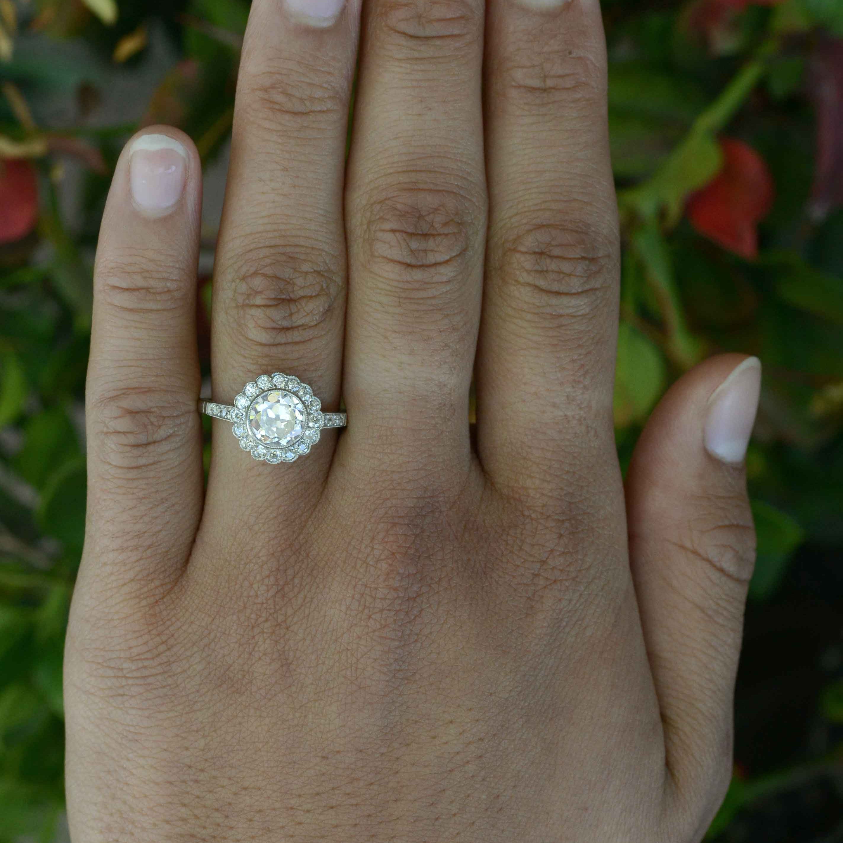 Old European diamond flower petal cluster engagement ring.