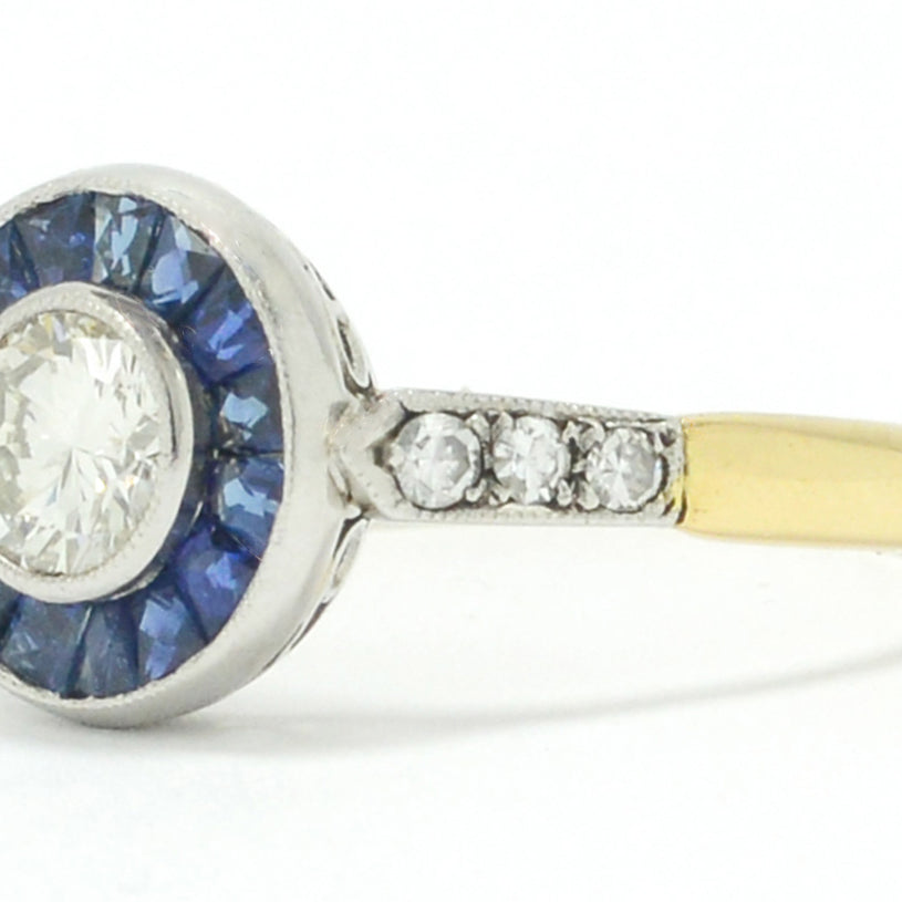 This estate bridal ring features a nearly half carat transitional round brilliant diamond.