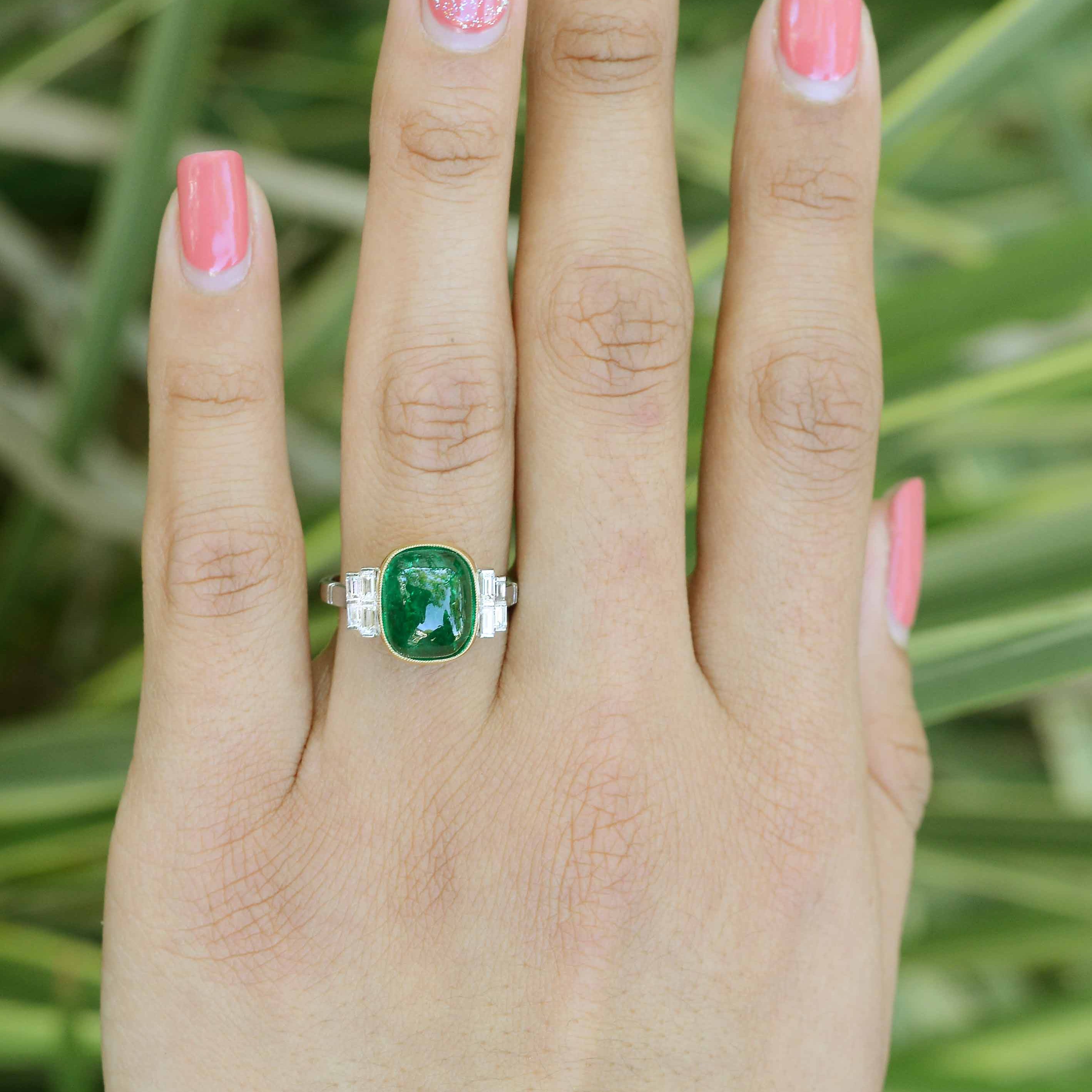 Eight diamonds accent to the side of the large 4 carat emerald statement ring.