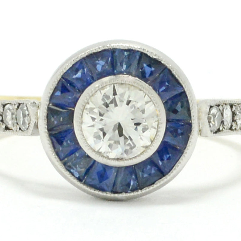 This blue sapphire target ring has a yellow gold band.