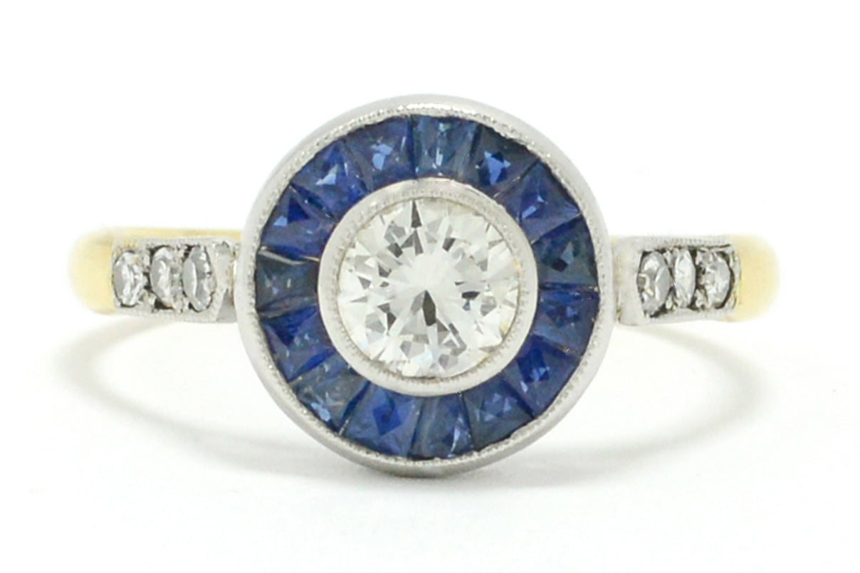 This blue sapphire target ring has a yellow gold band.