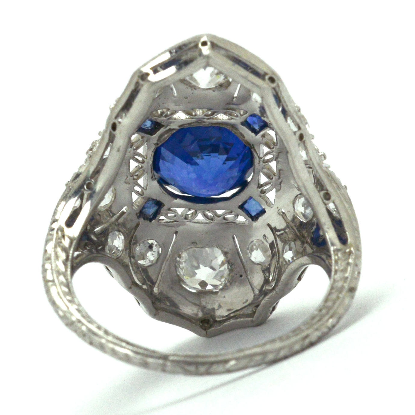 This long platinum shield cocktail ring holds a 2 carat round sapphire and diamonds.