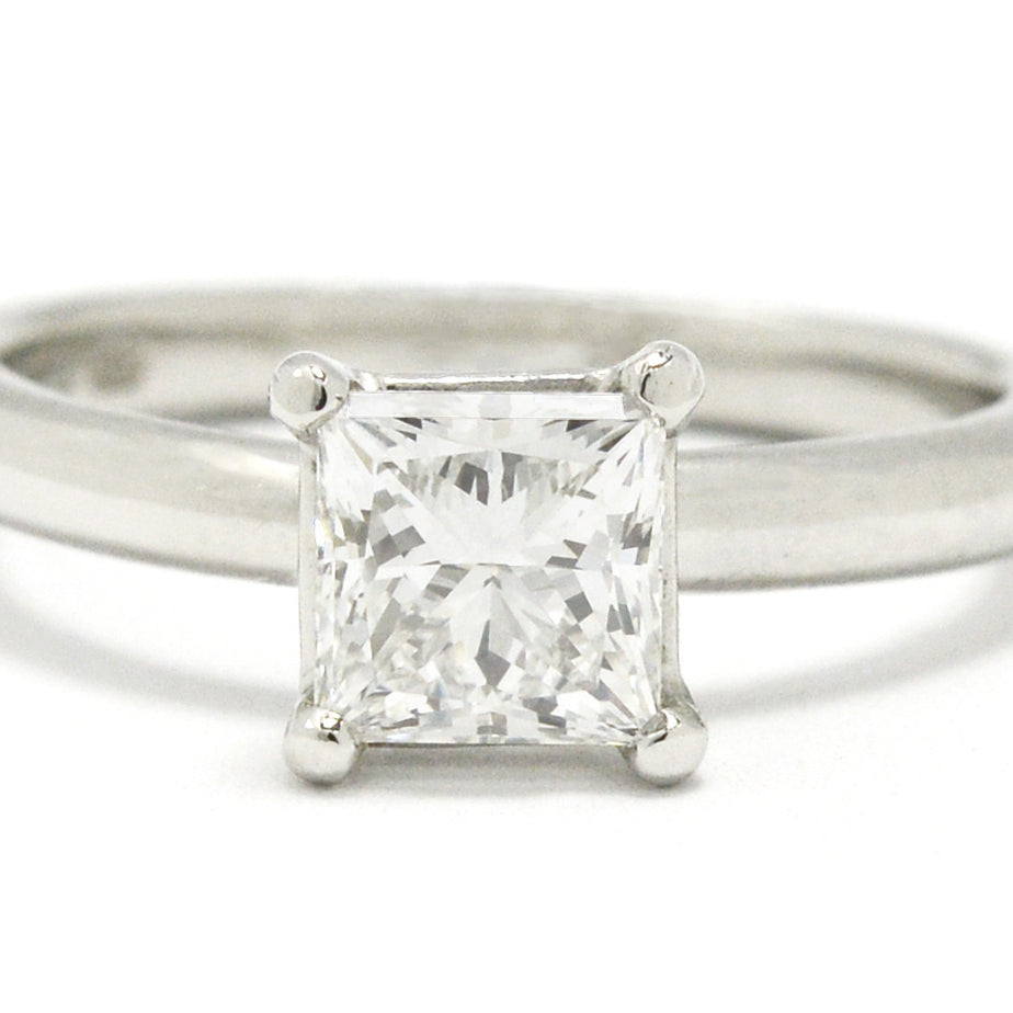 An f color with Vvs2 clarity princess cut diamond platinum solitaire ring.