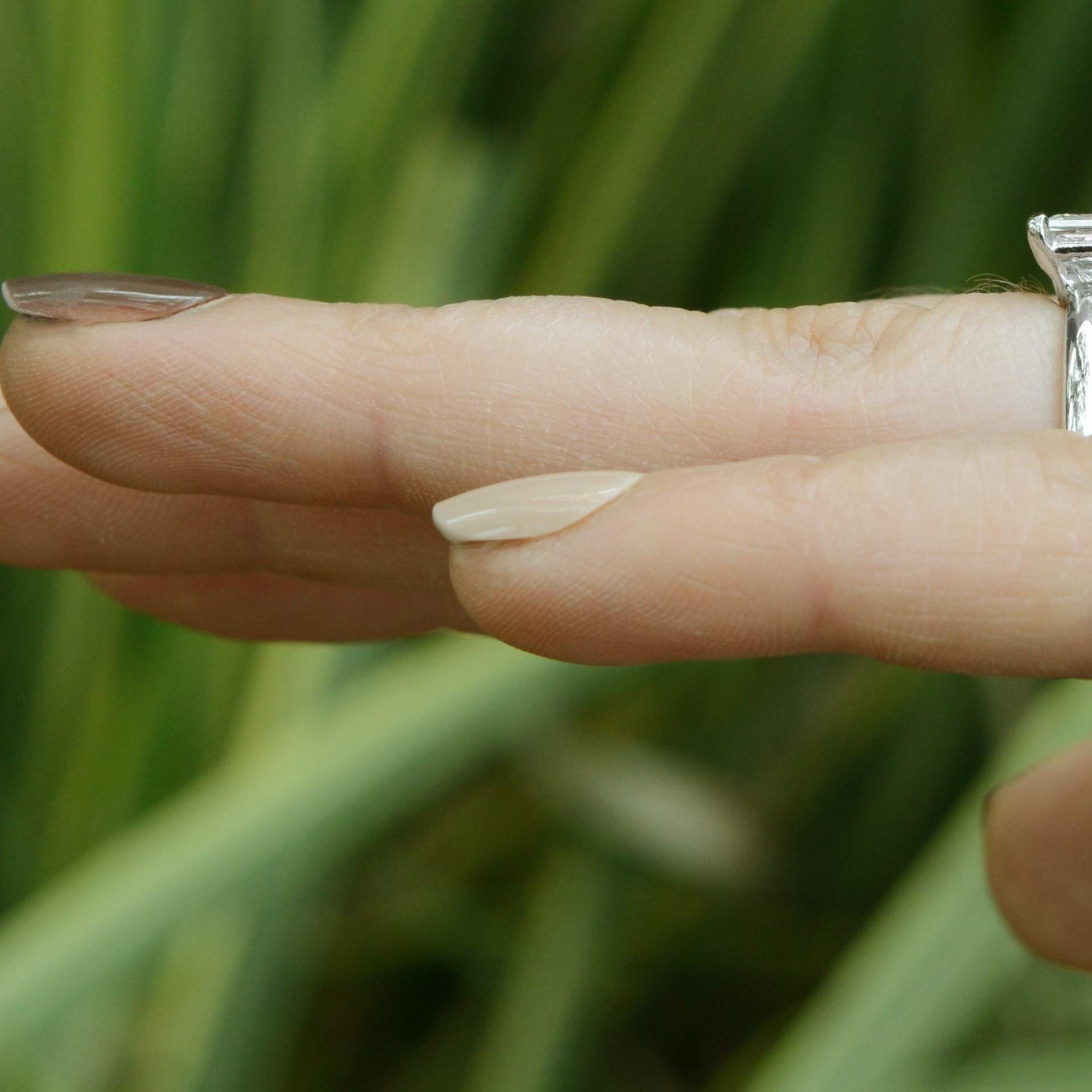 A simple, princess cut diamond solitaire engagement ring.