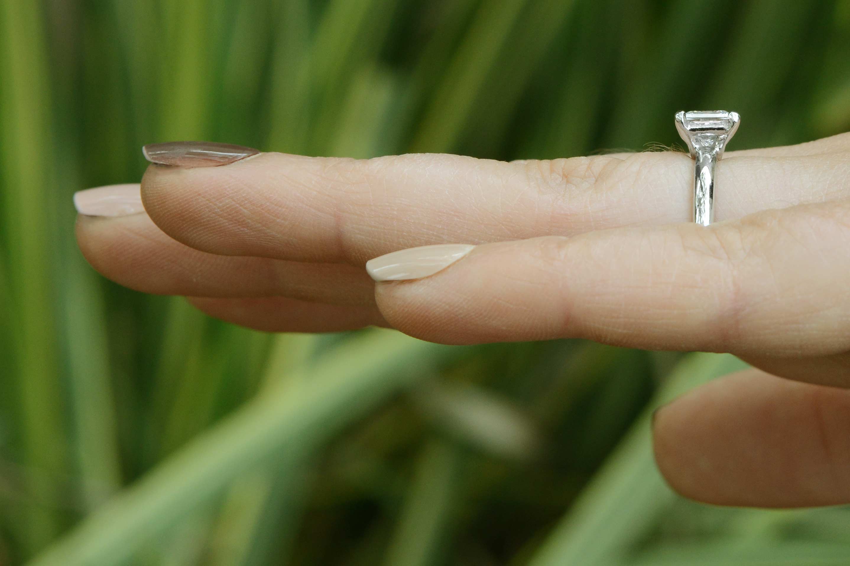 A simple, princess cut diamond solitaire engagement ring.