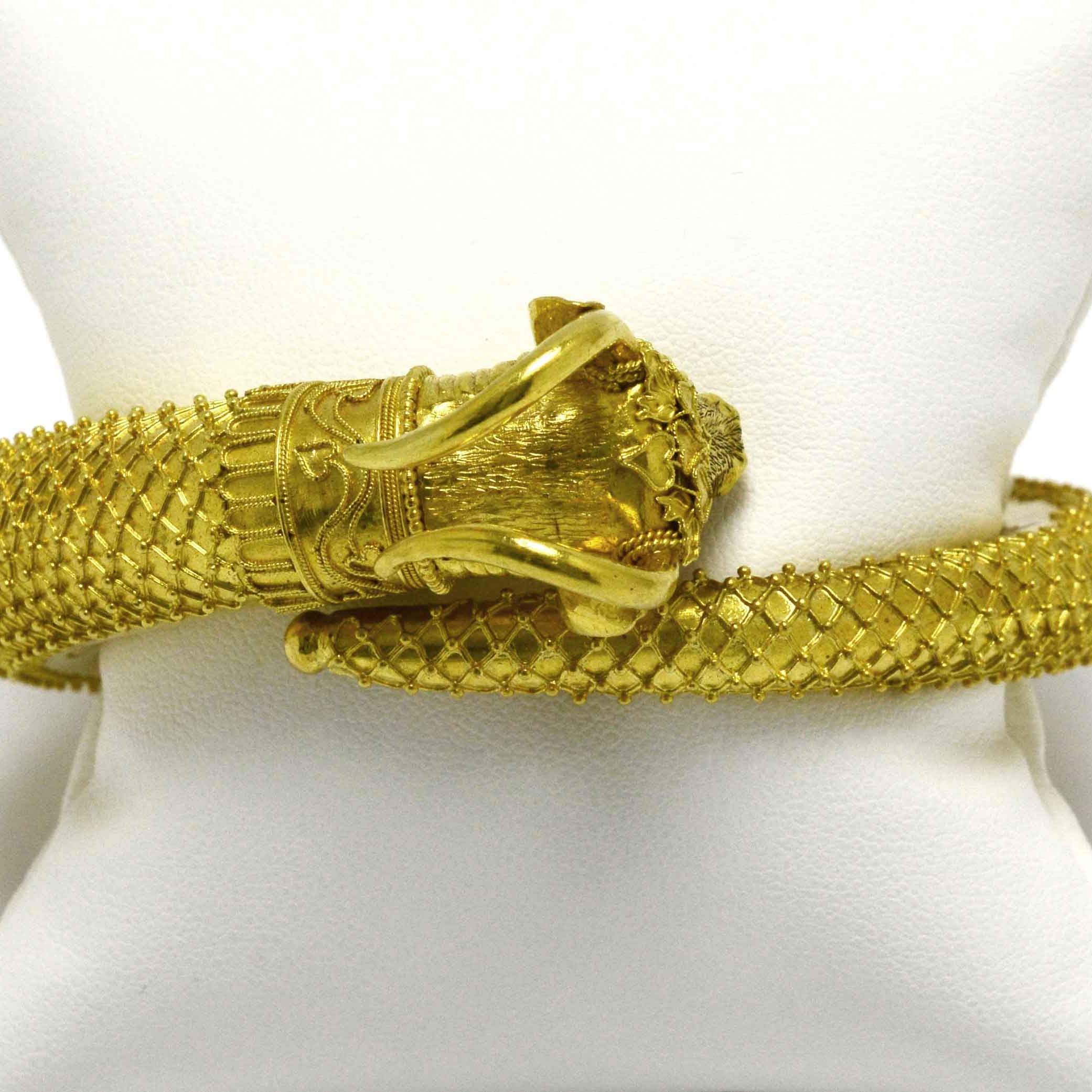 Gold horns raise above this unique, heavy 22k gold ram bracelet.
