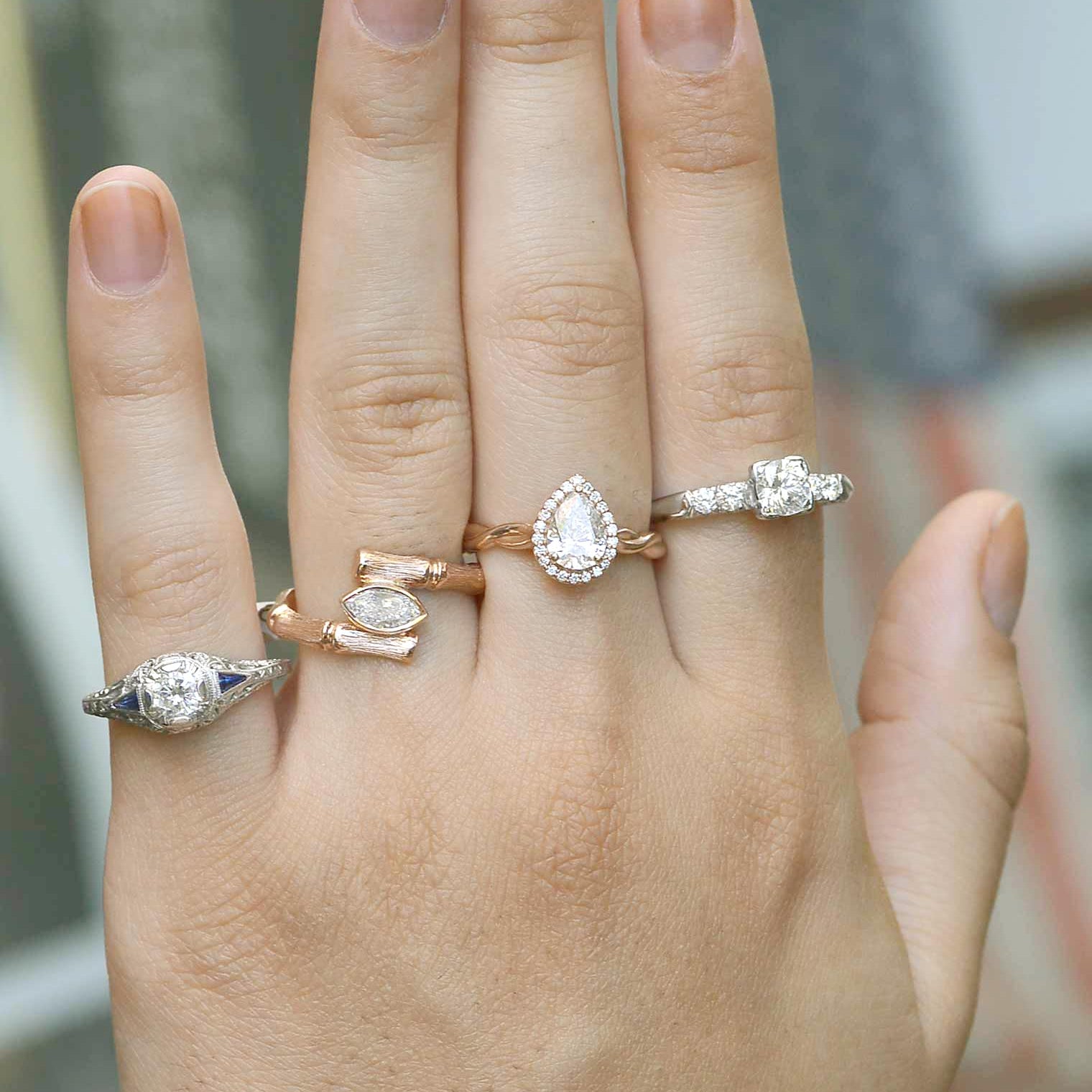A variety of vintage and retro diamond rings crafted of platinum and rose gold.