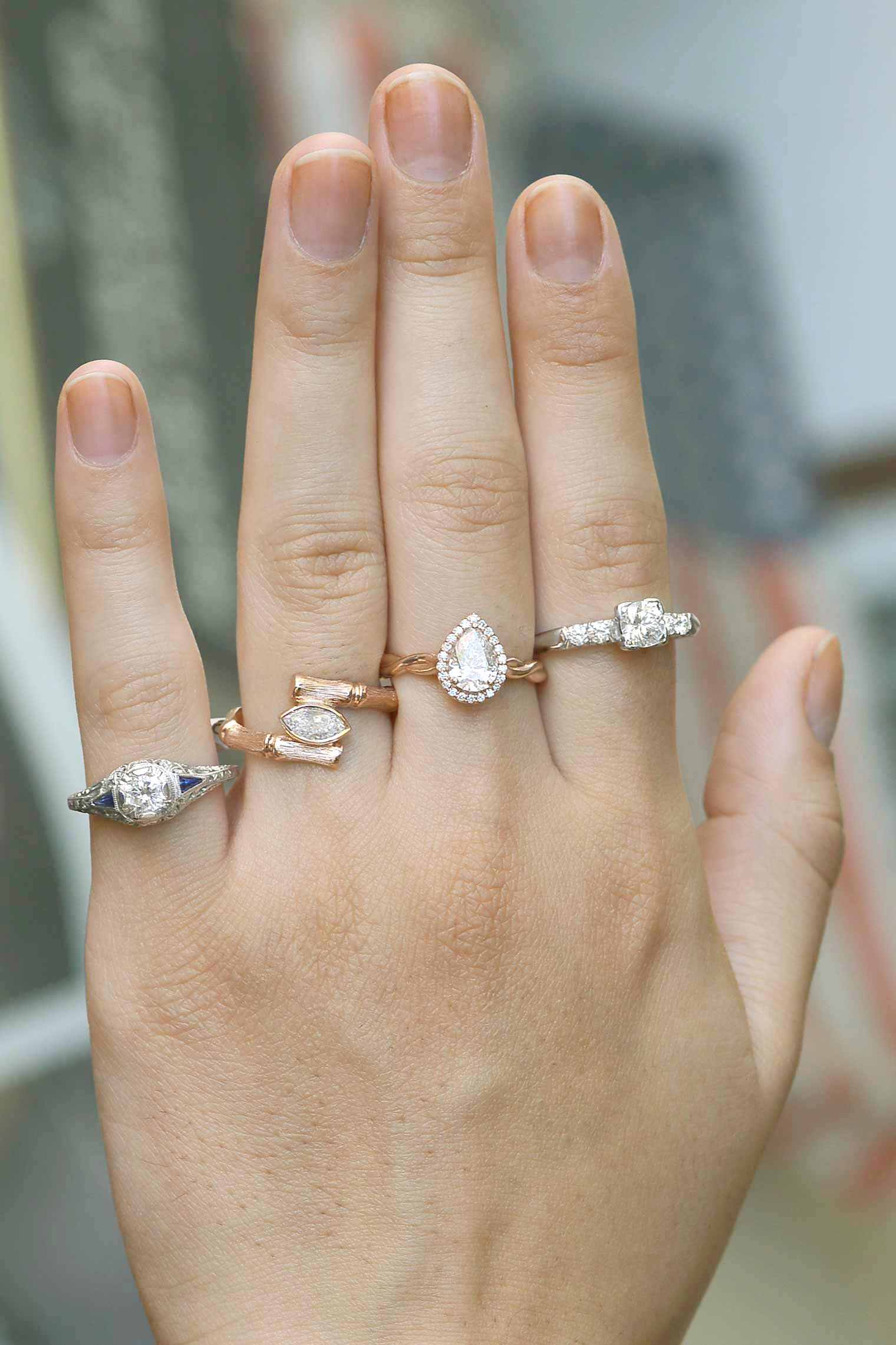 A variety of vintage and retro diamond rings crafted of platinum and rose gold.