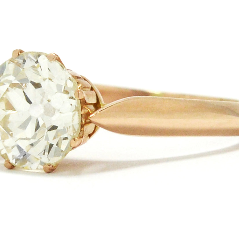 A large diamond 18k rose gold antique Victorian solitaire engagement ring.