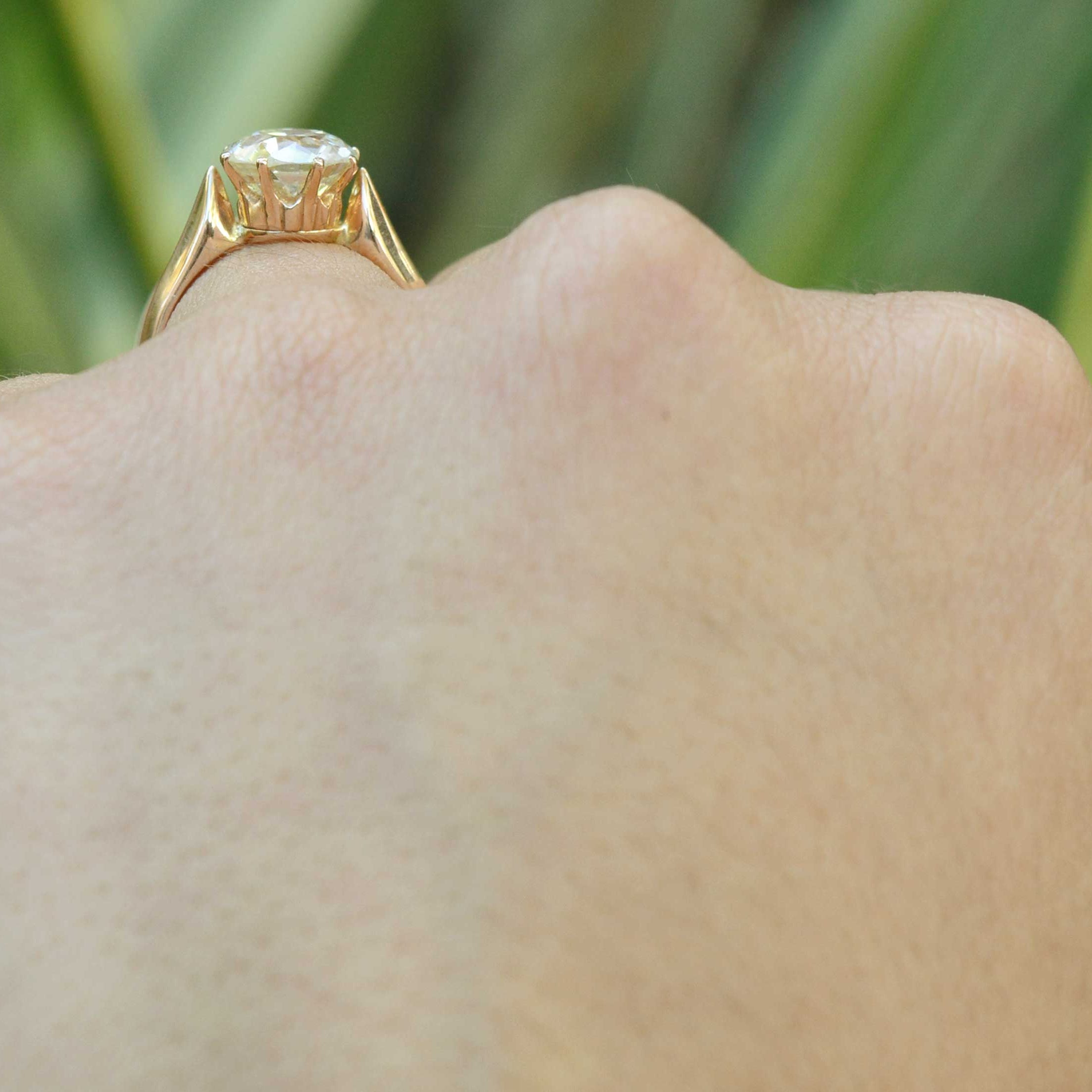 This diamond solitaire ring has a regal crown setting made of rich, warm 18k rose gold.