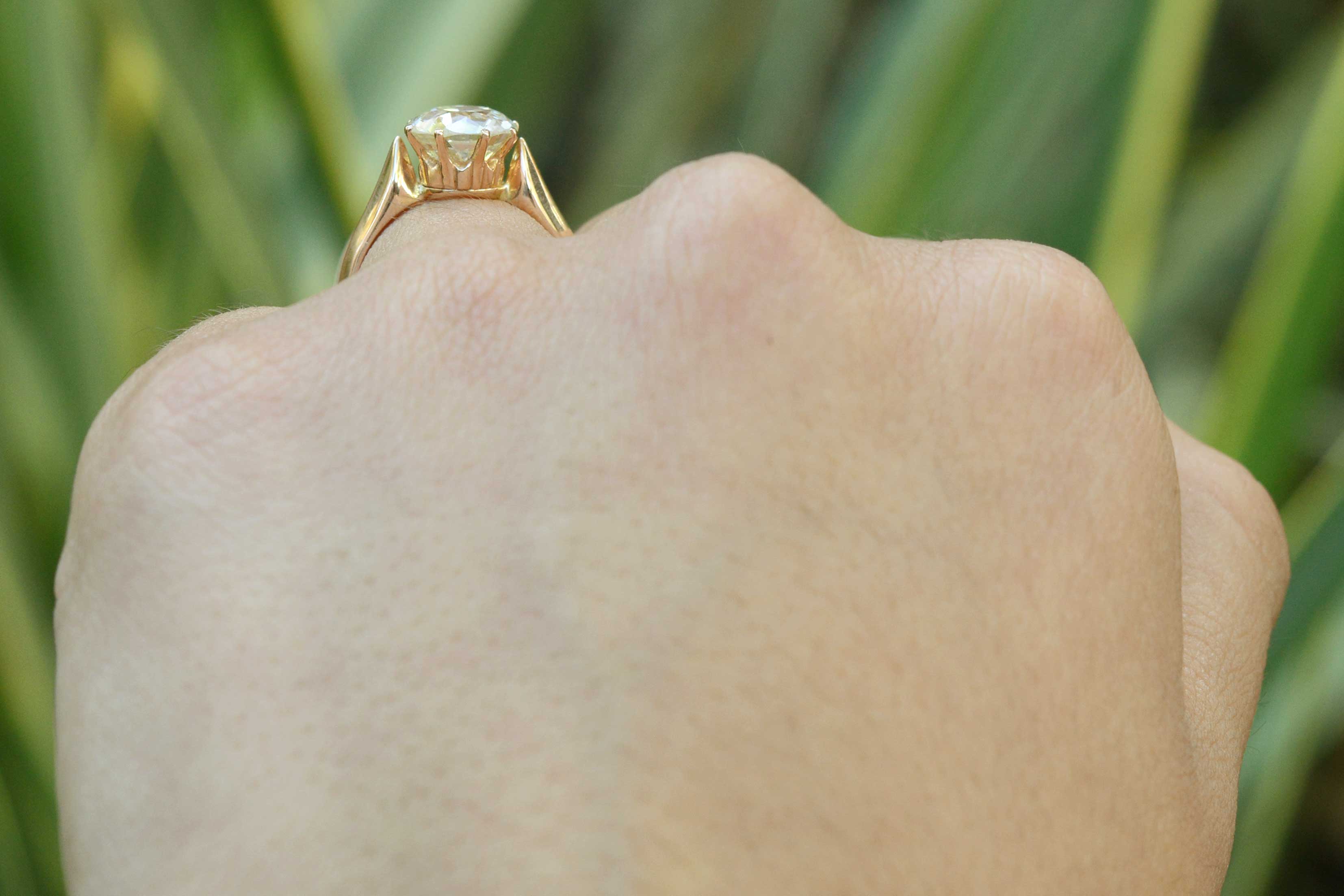 This diamond solitaire ring has a regal crown setting made of rich, warm 18k rose gold.