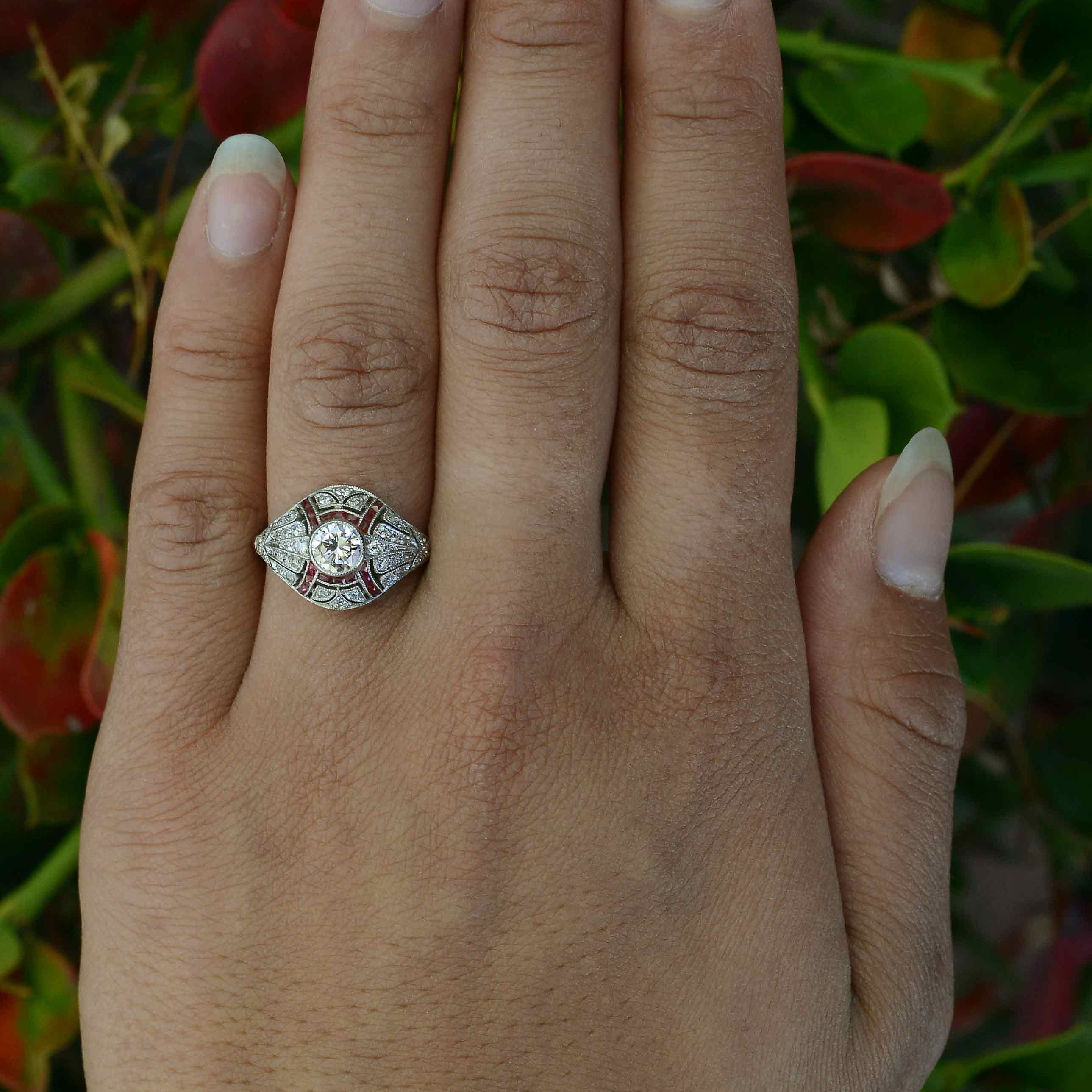 Hand fabricated diamond engagement ring, accented by rubies.