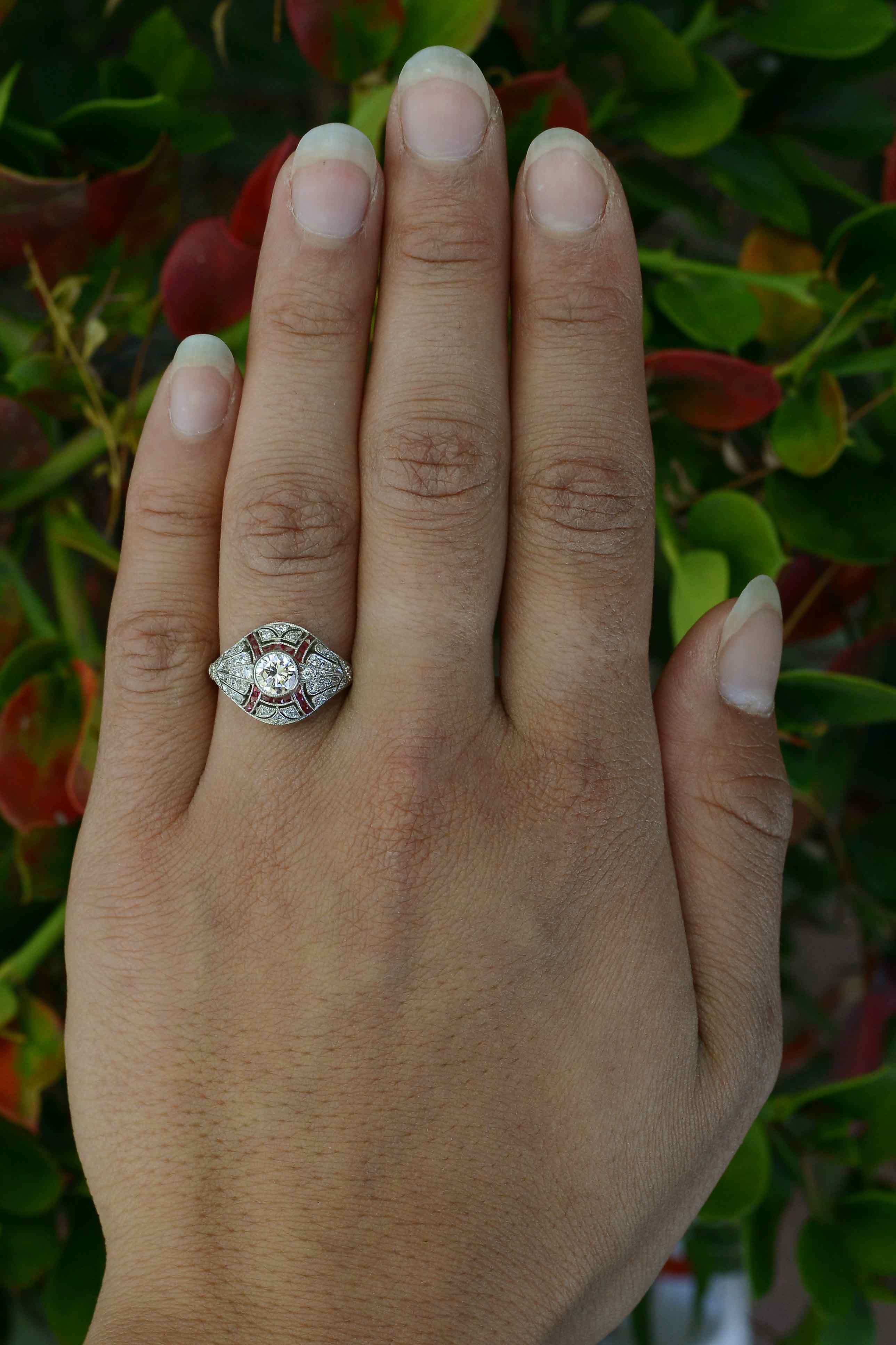Hand fabricated diamond engagement ring, accented by rubies.